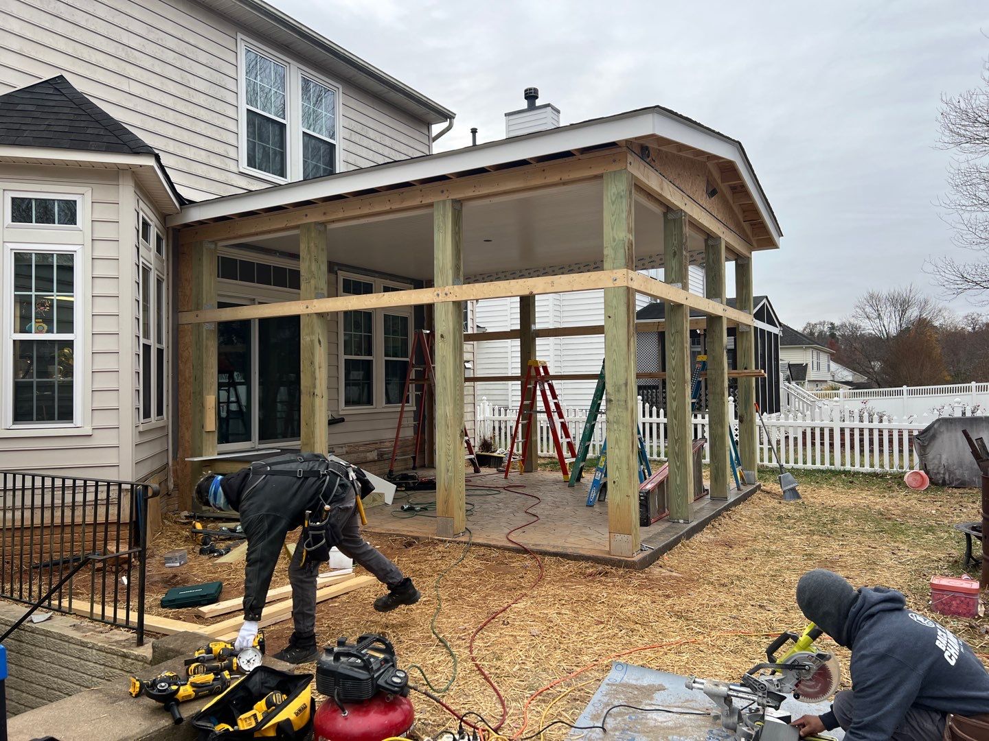 Custom Screened-In Porch with Stamped Concrete Patio in Warrenton by Jakari Restoration & Construction LLC