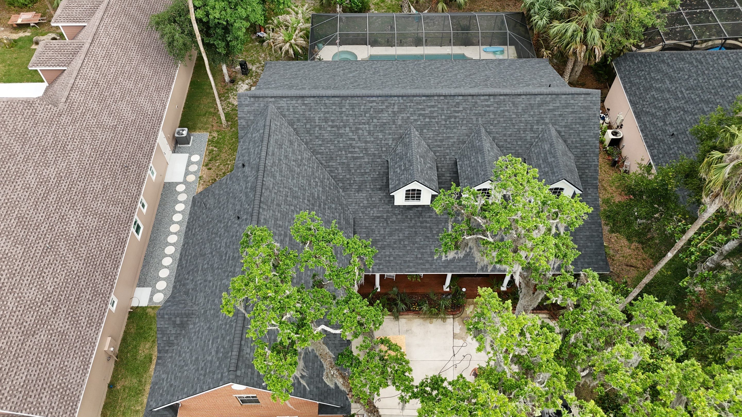 Comprehensive Onyx Black Asphalt Shingle Roof Replacement for Flagler Beach Residence by Trinity Restoration and Roofing LLC