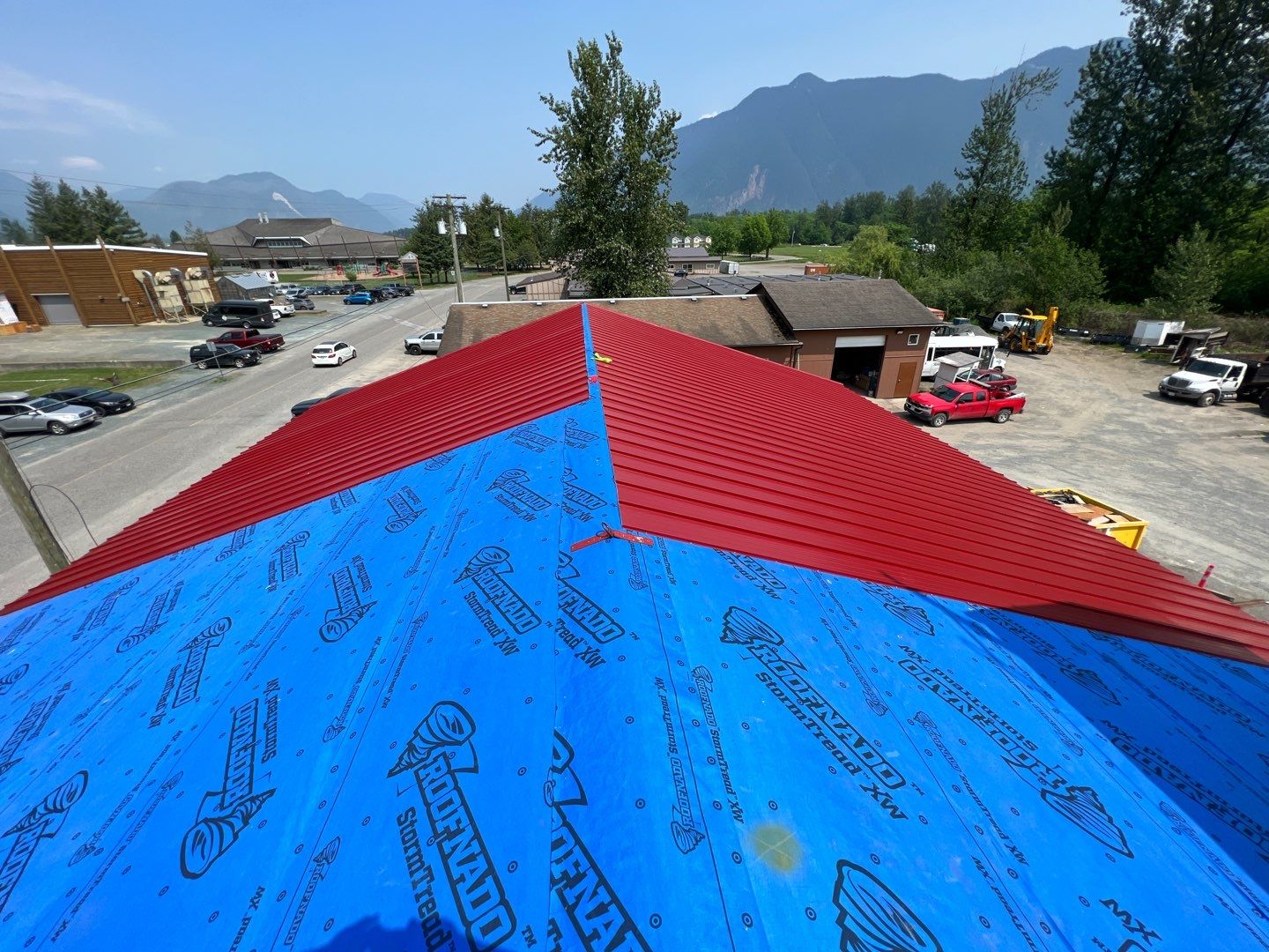 Commercial Roofing Installation using 12" Prolok metal by Top Notch Roofing Inc
