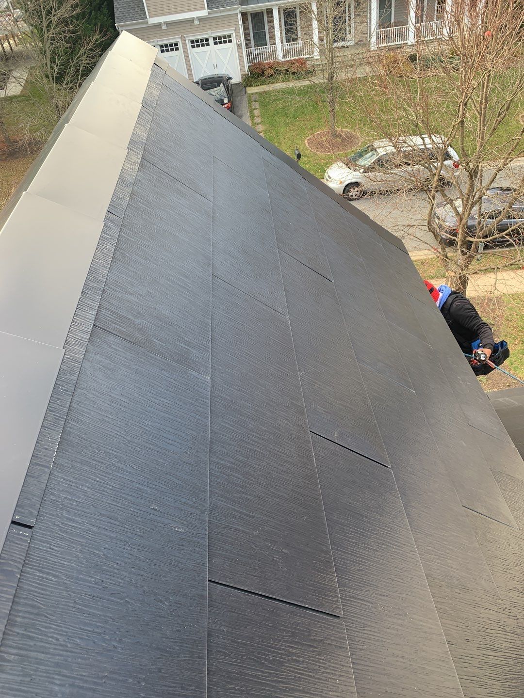 Tesla Solar Roof and Gutter Installation by American Home Contractors