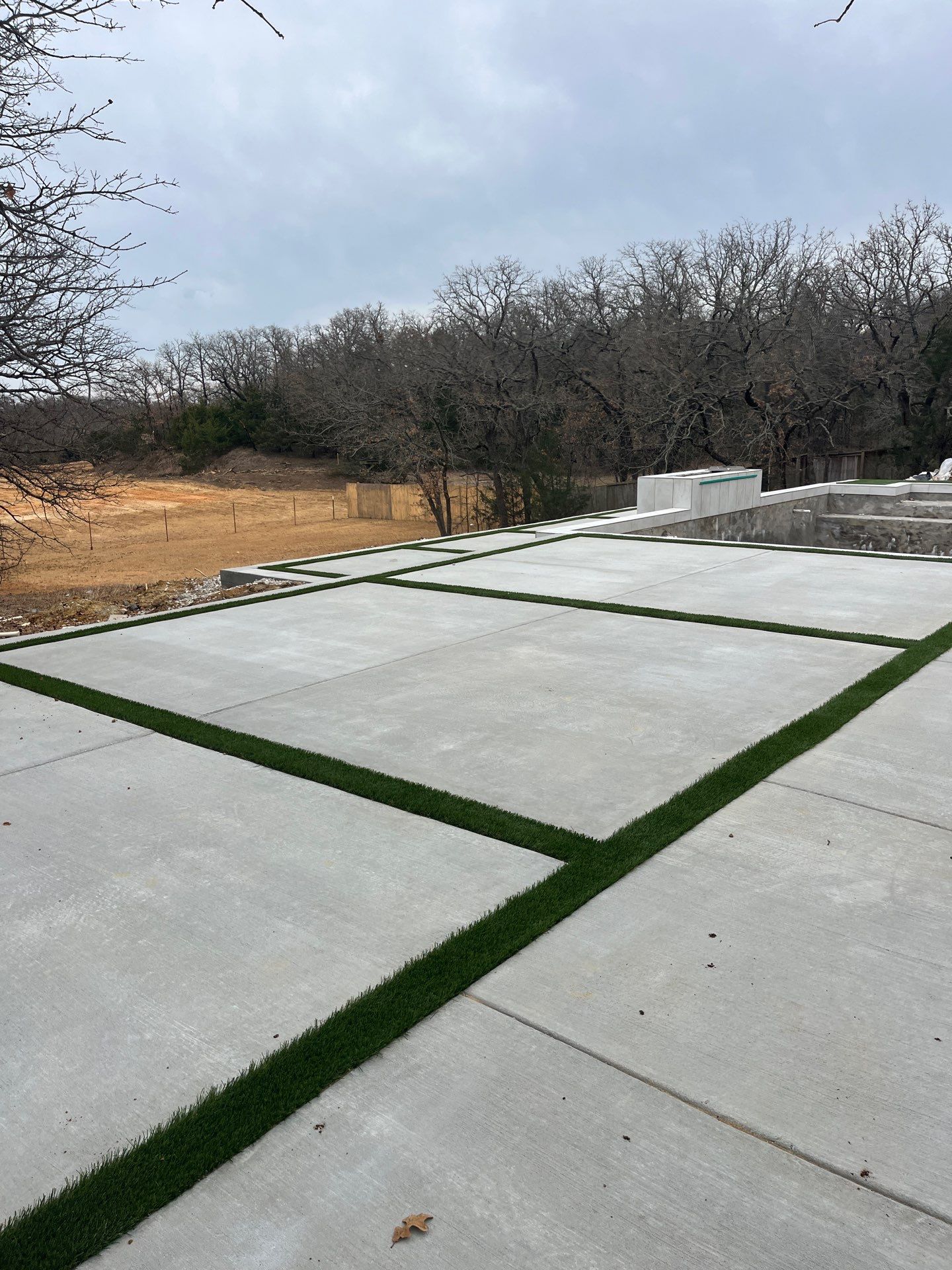 Modern Geometric Pool with Raised Spa and Turf Accents by Pinnacle Pools and Spas - DFW