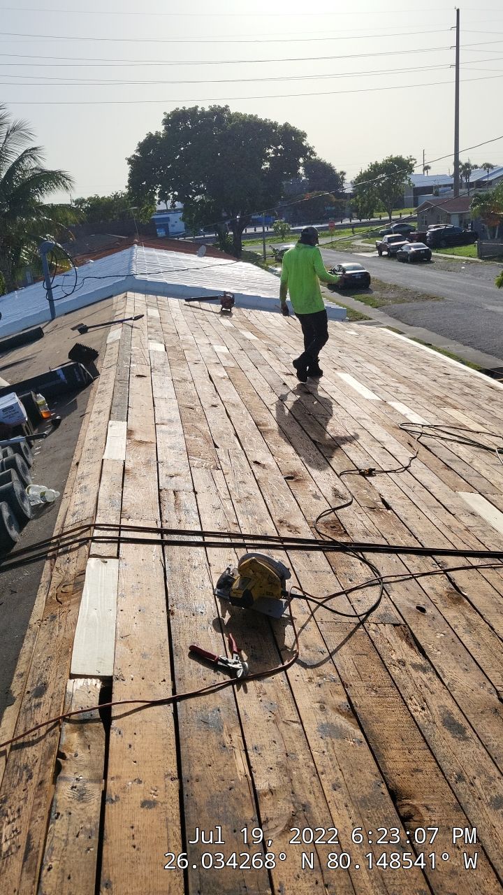 Standing Seam Metal & Flat Re-Roof using 1.5" Nail Strip 24ga Black Matte Kynar Coated Standing Seam Metal Panels by Morton Roofing, Inc.