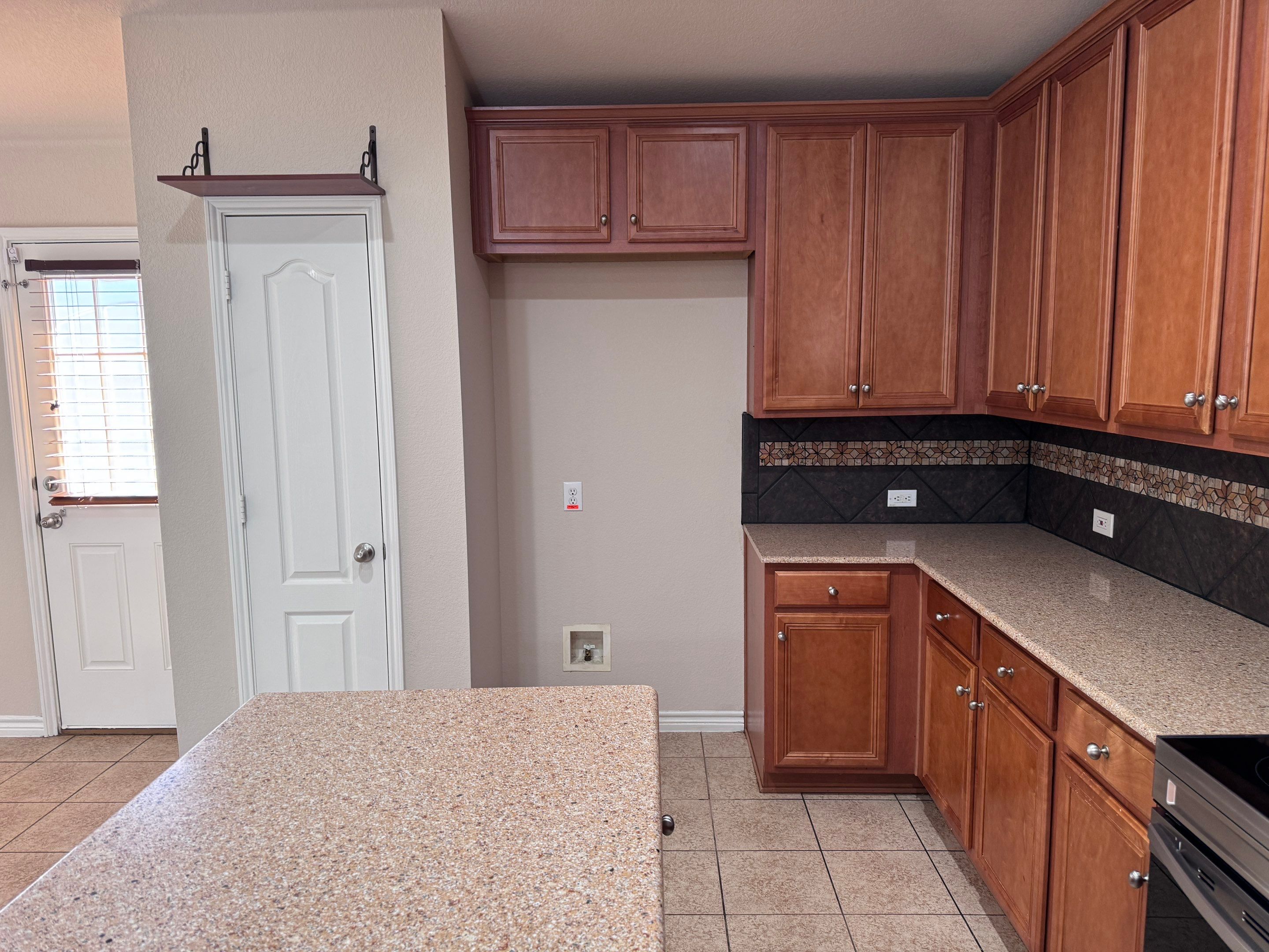 Luxury Focal Point: Full Kitchen Remodel with Double Waterfall Island by Tibi Soli LLC