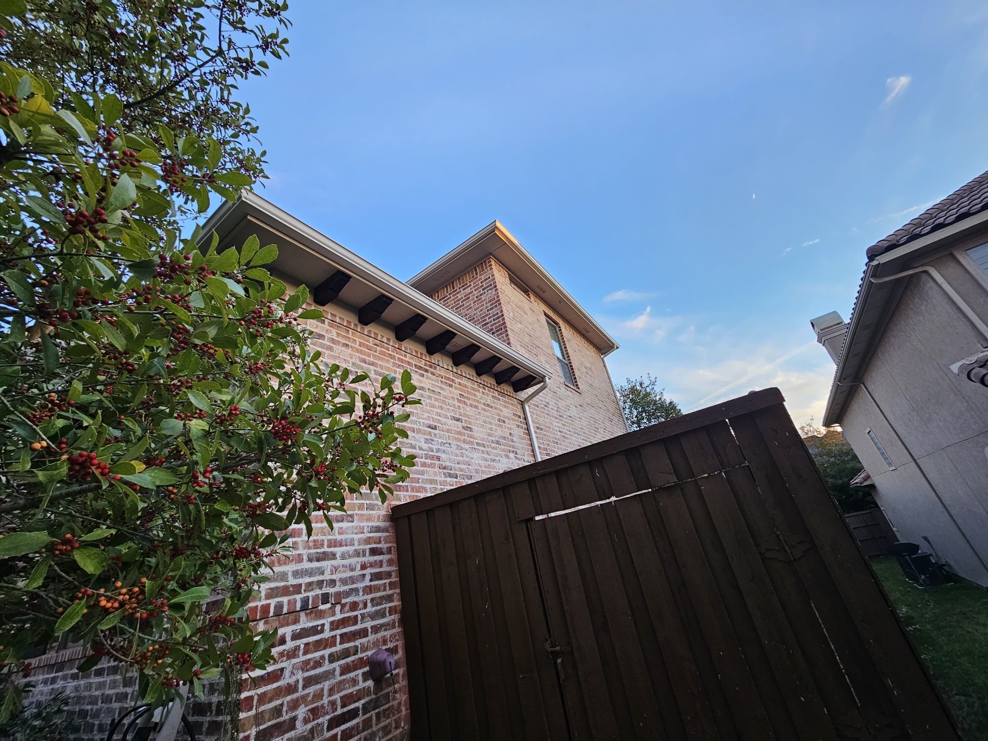 Light red brick/cream stone/espresso shutters with IKO Cornerstone by Tejas Roofworks + Restoration
