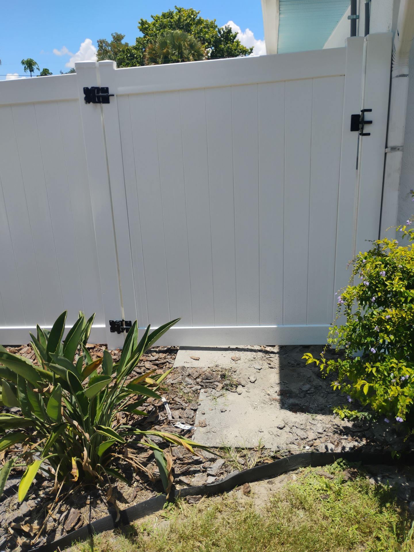 White Vinyl Privacy Fence Installation and Gate Repair in Port Charlotte by True Fence LLC