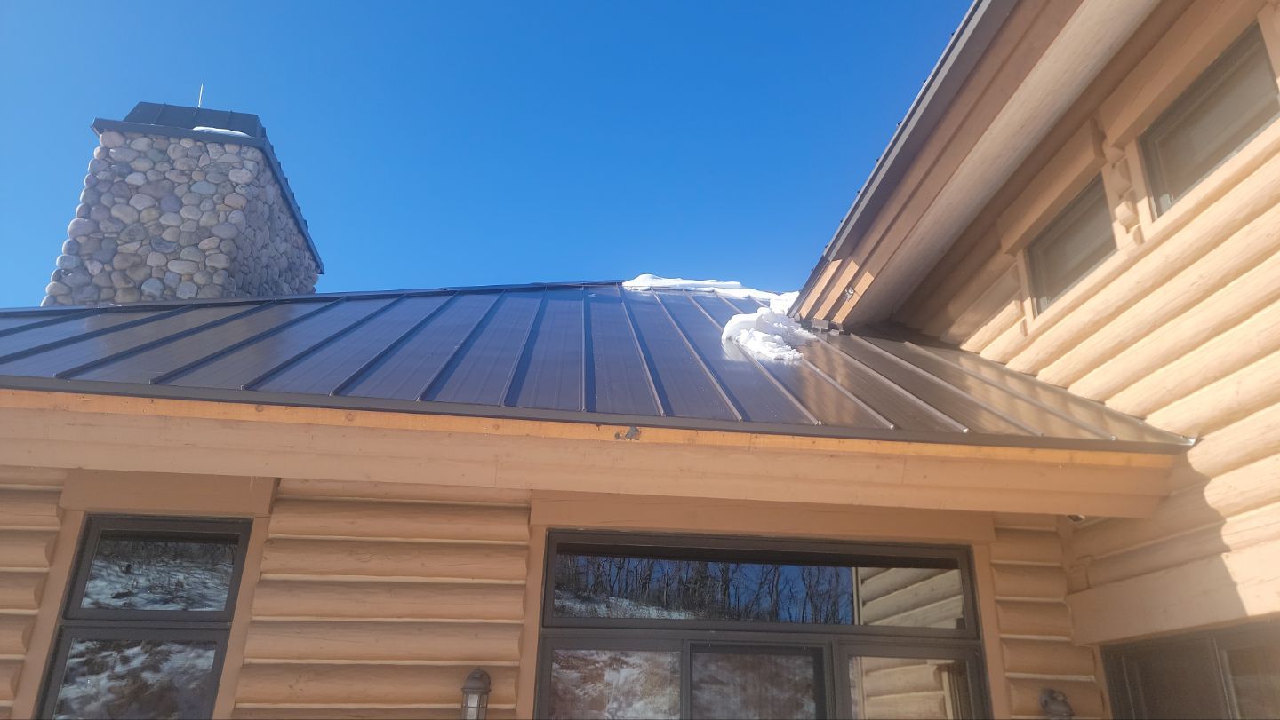 Standing Seam Metal Roof Replacement After Snow Damage by ASAP Roofing & Restoration
