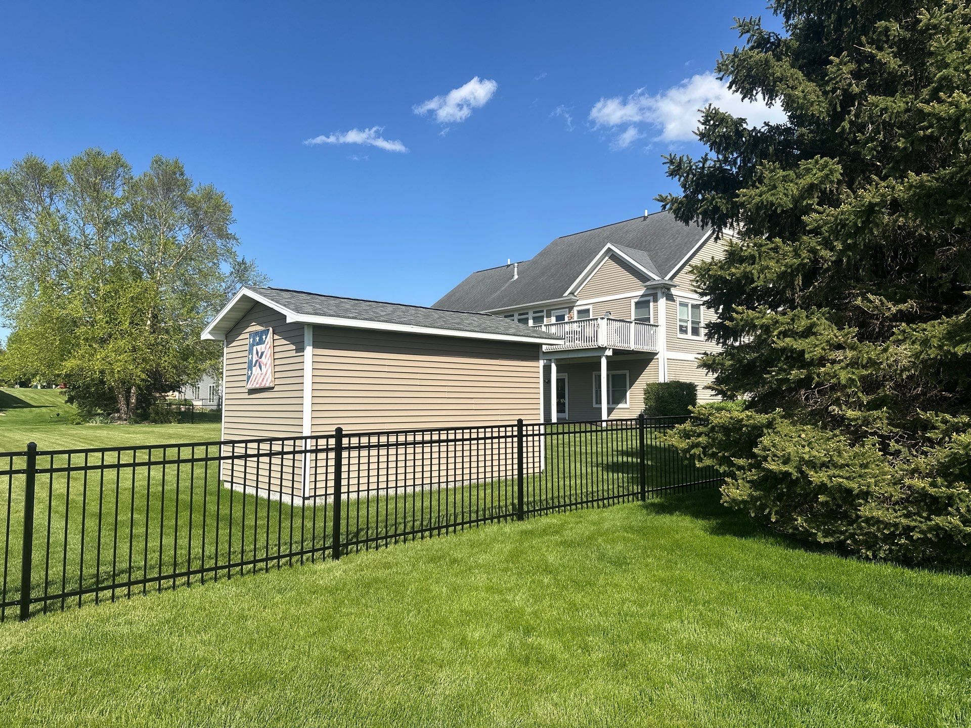 Black Ornamental Metal Picket Fence Installation in Waterloo by Perfect Picket Fence and Stain