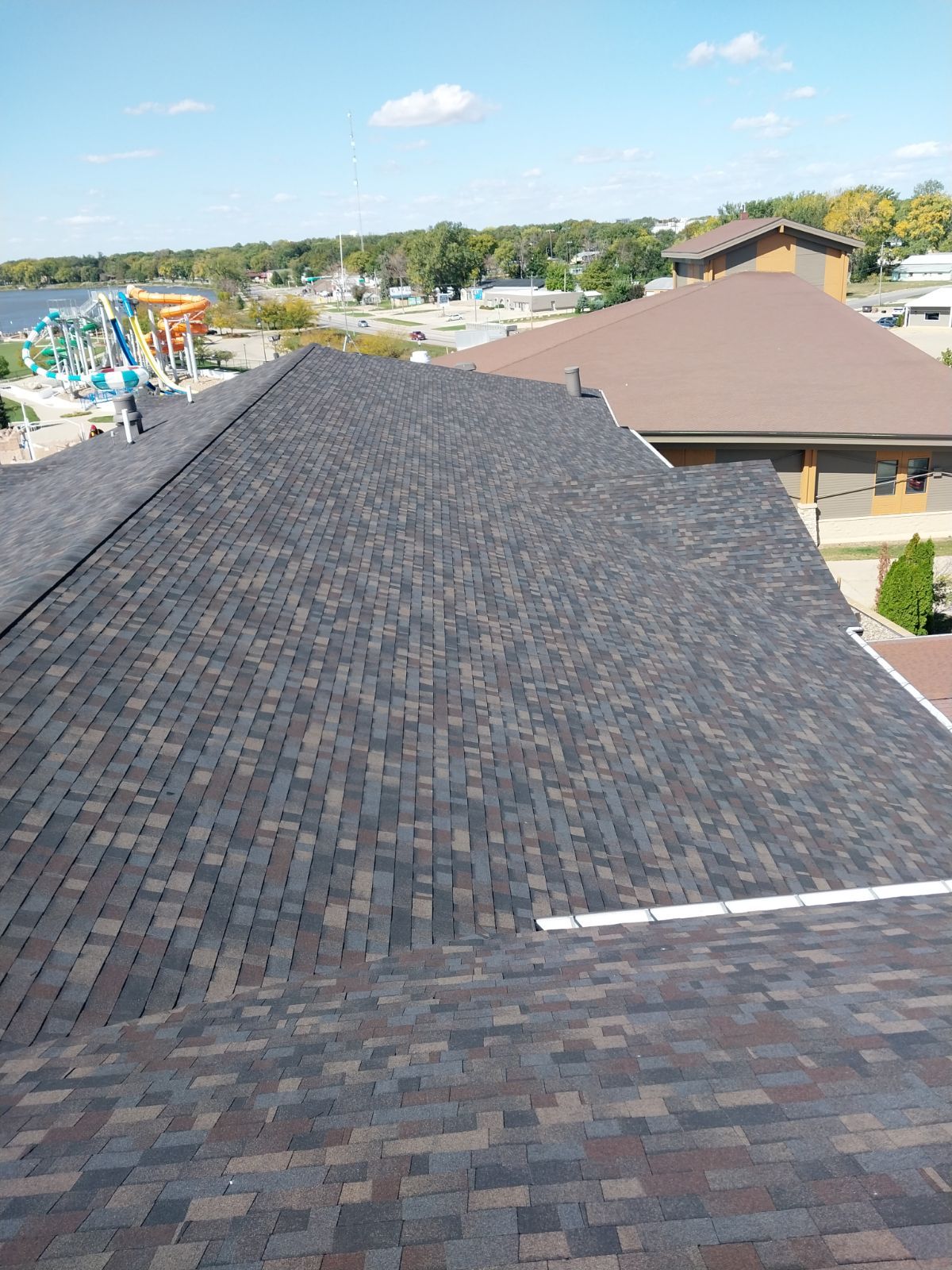 Commercial Roofing Installation using Shingles by Grell Roofing, LLC