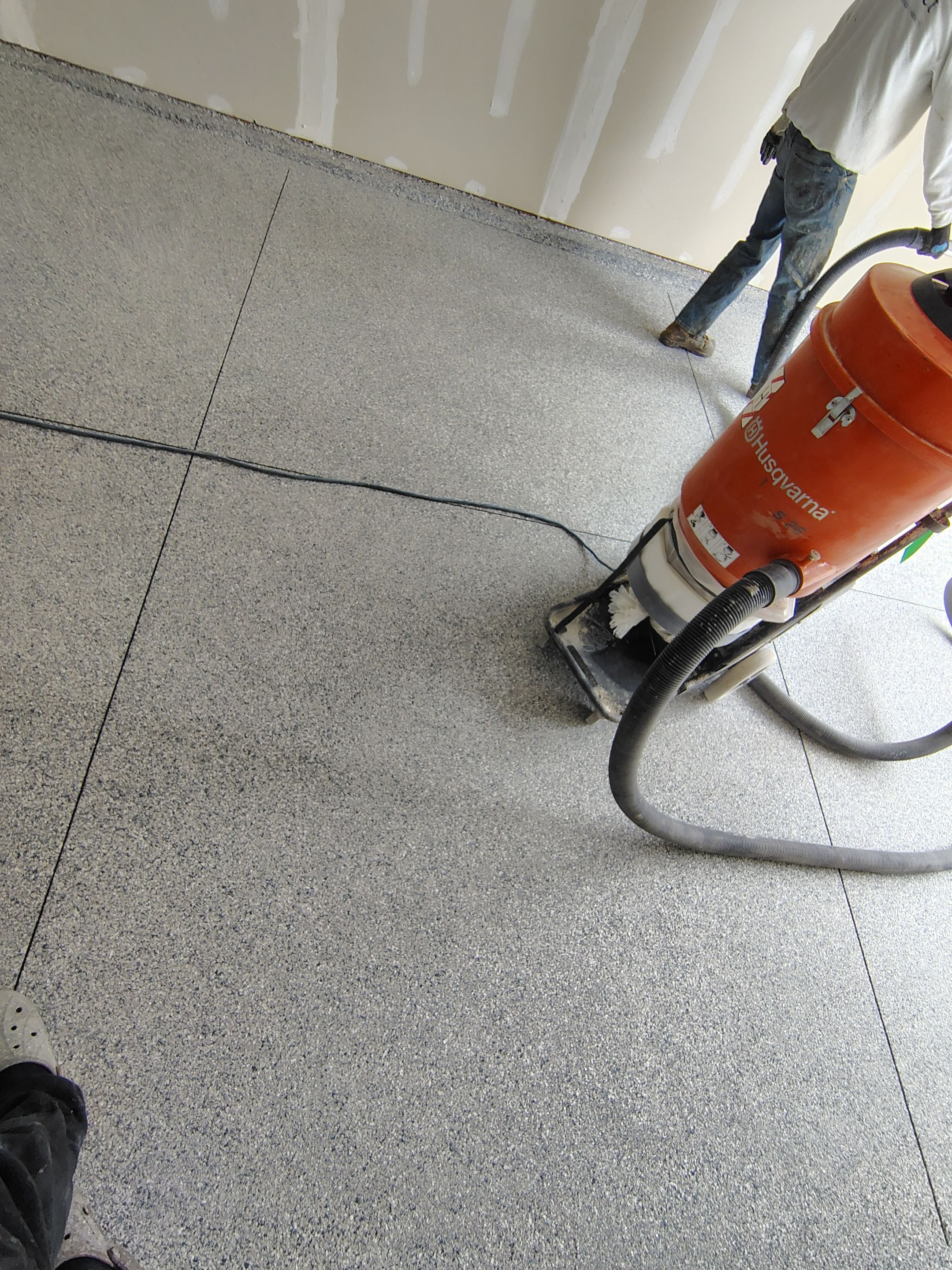 Custom Epoxy Garage Floor Coating Installation in Sioux Falls by Select Painting, Coatings & Garage Cabinets