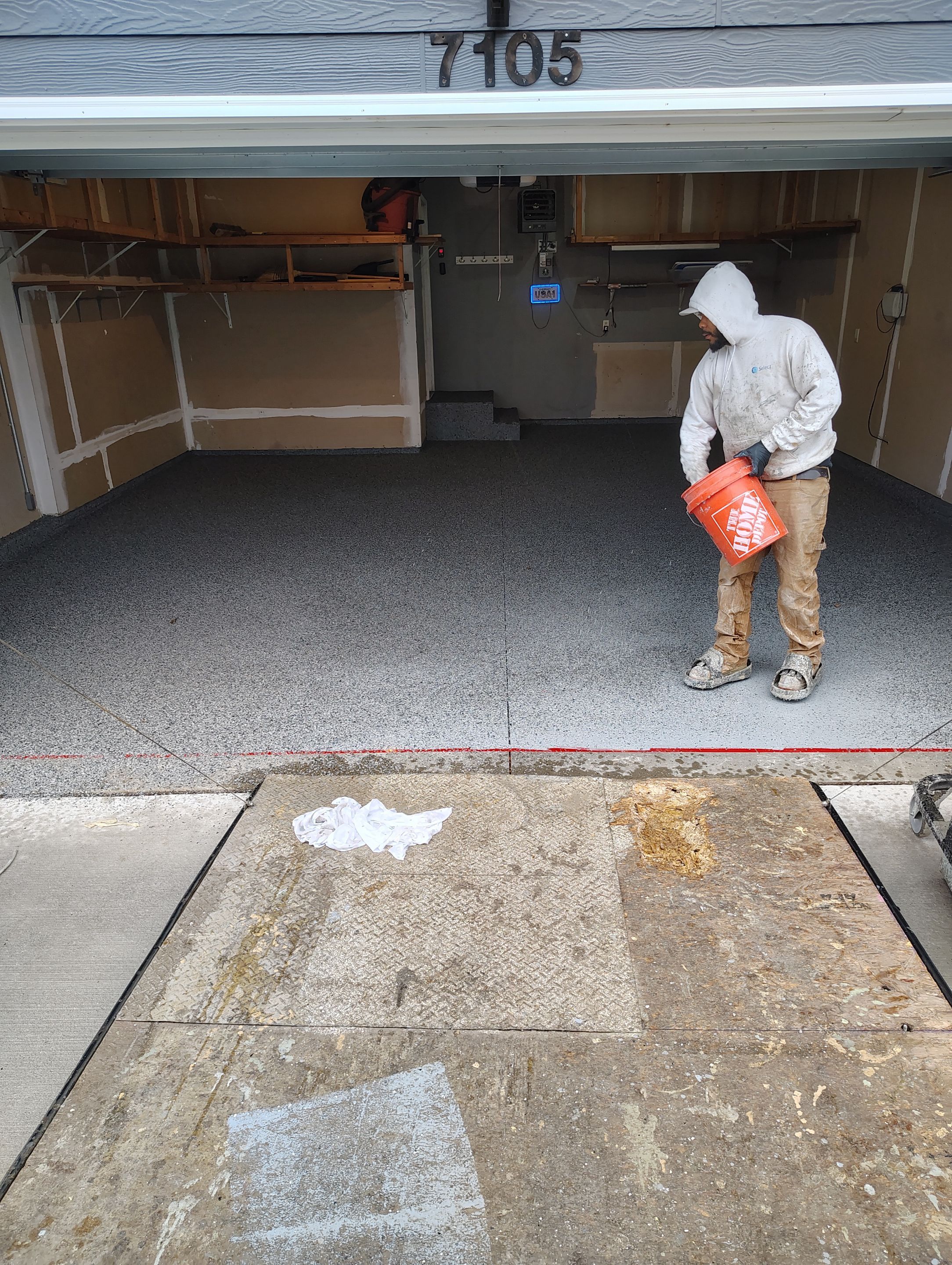 Nightfall Grey Speckled Epoxy Garage Floor Coating in Sioux Falls by Select Painting, Coatings & Garage Cabinets