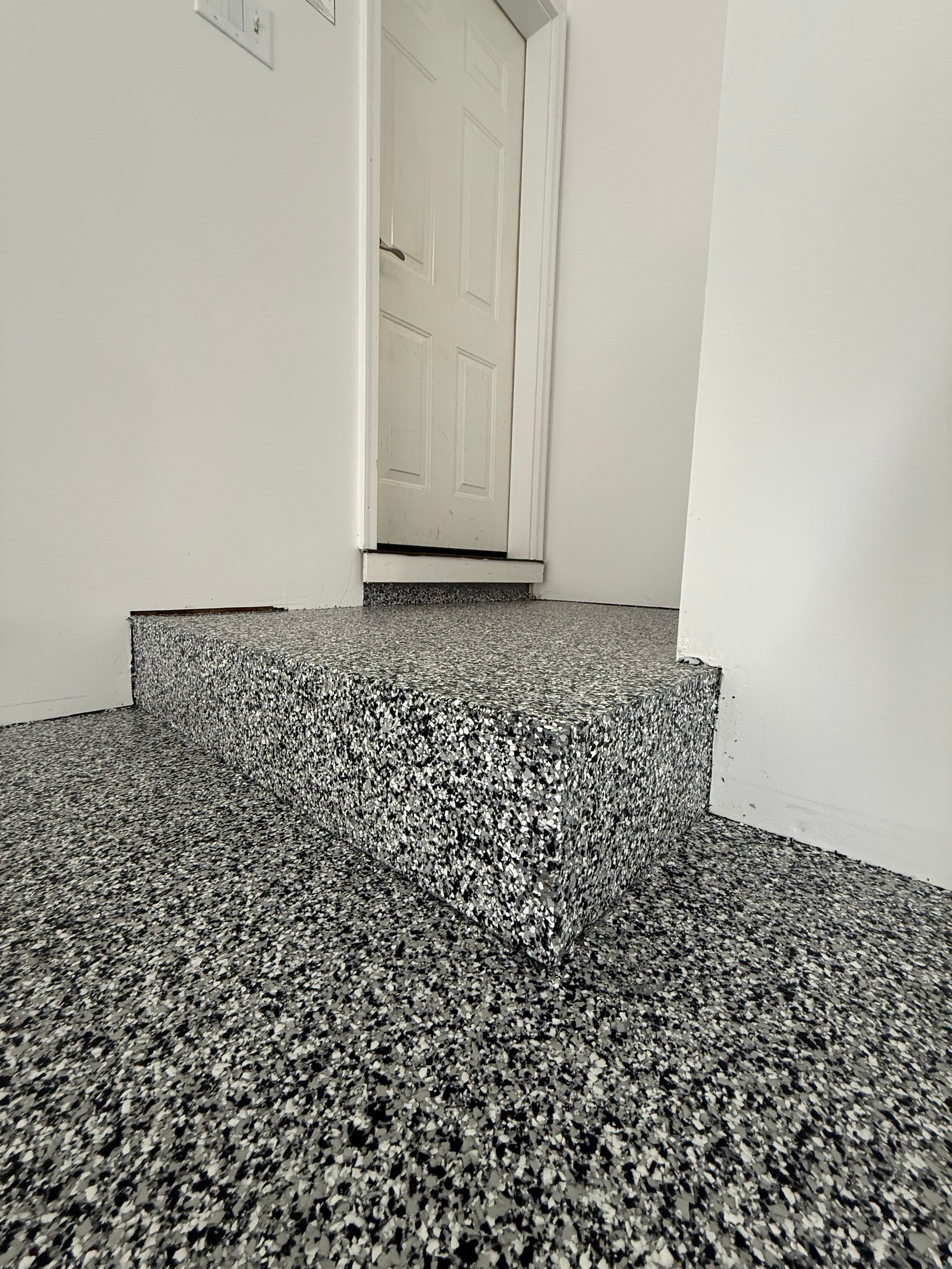 Full Garage Floor and Basement Stair Epoxy Coating in Sioux Falls by Select Painting, Coatings & Garage Cabinets