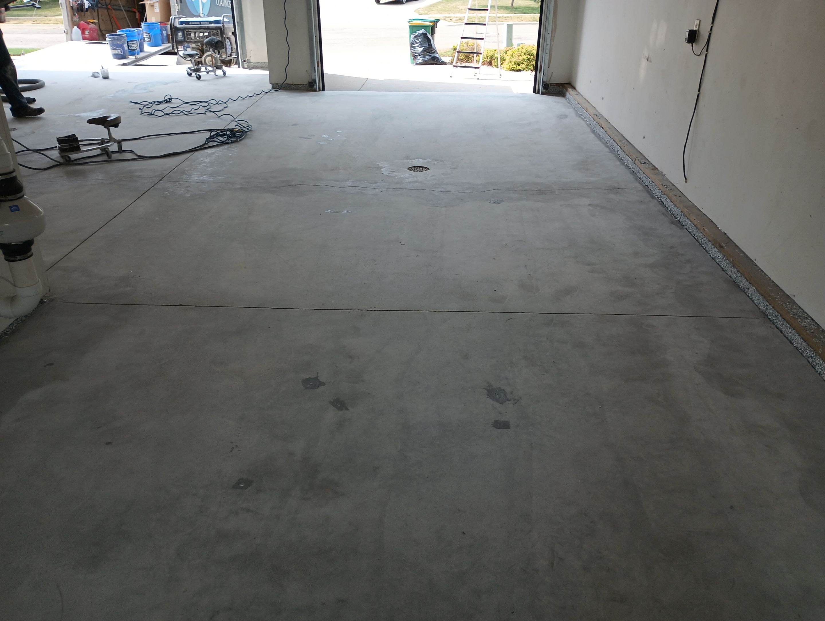 Garage Concrete Coating Installation in Sioux Falls Using Tidal Wave Finish by Select Painting, Coatings & Garage Cabinets