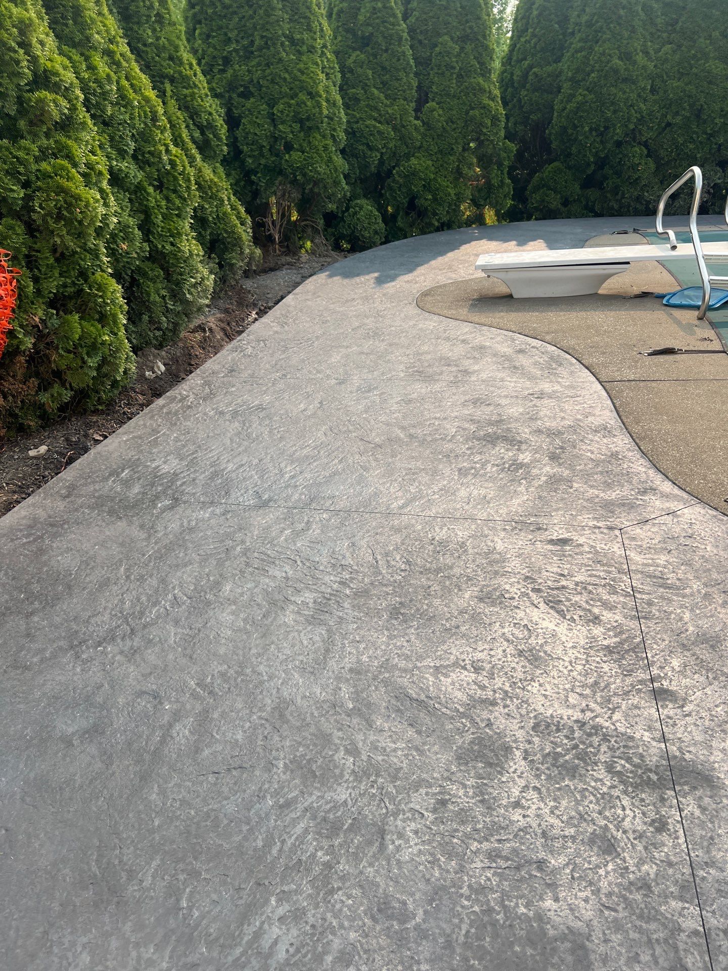 Bluestone stamped concrete patio  by NG Masonry & Construction LLC