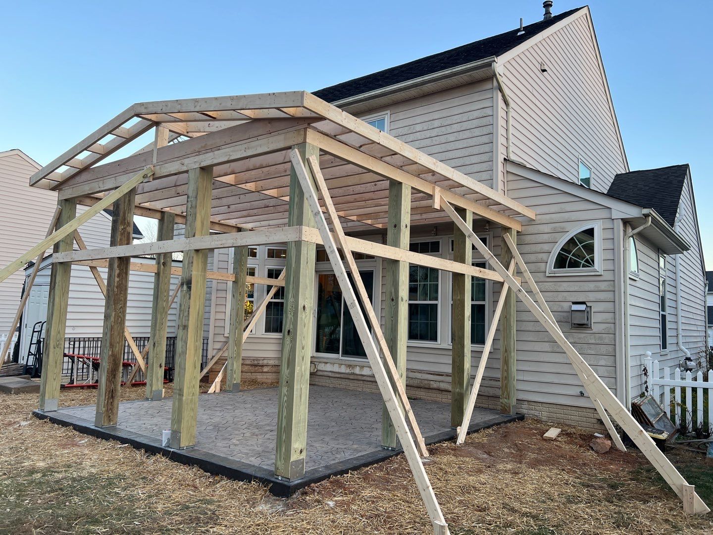 Custom Screened-In Porch with Stamped Concrete Patio in Warrenton by Jakari Restoration & Construction LLC