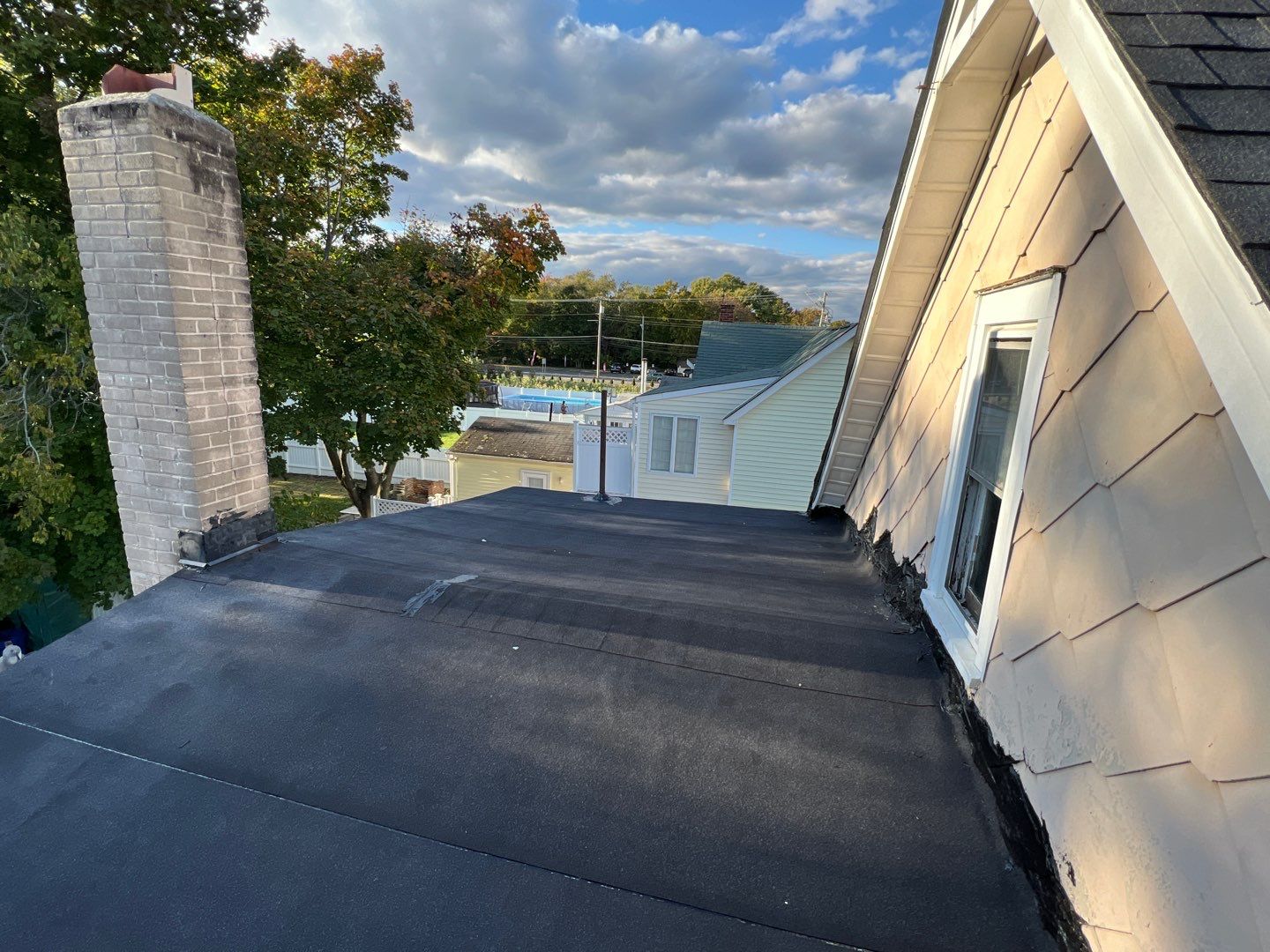 Onyx Black Shingles by Reimagine Roofing