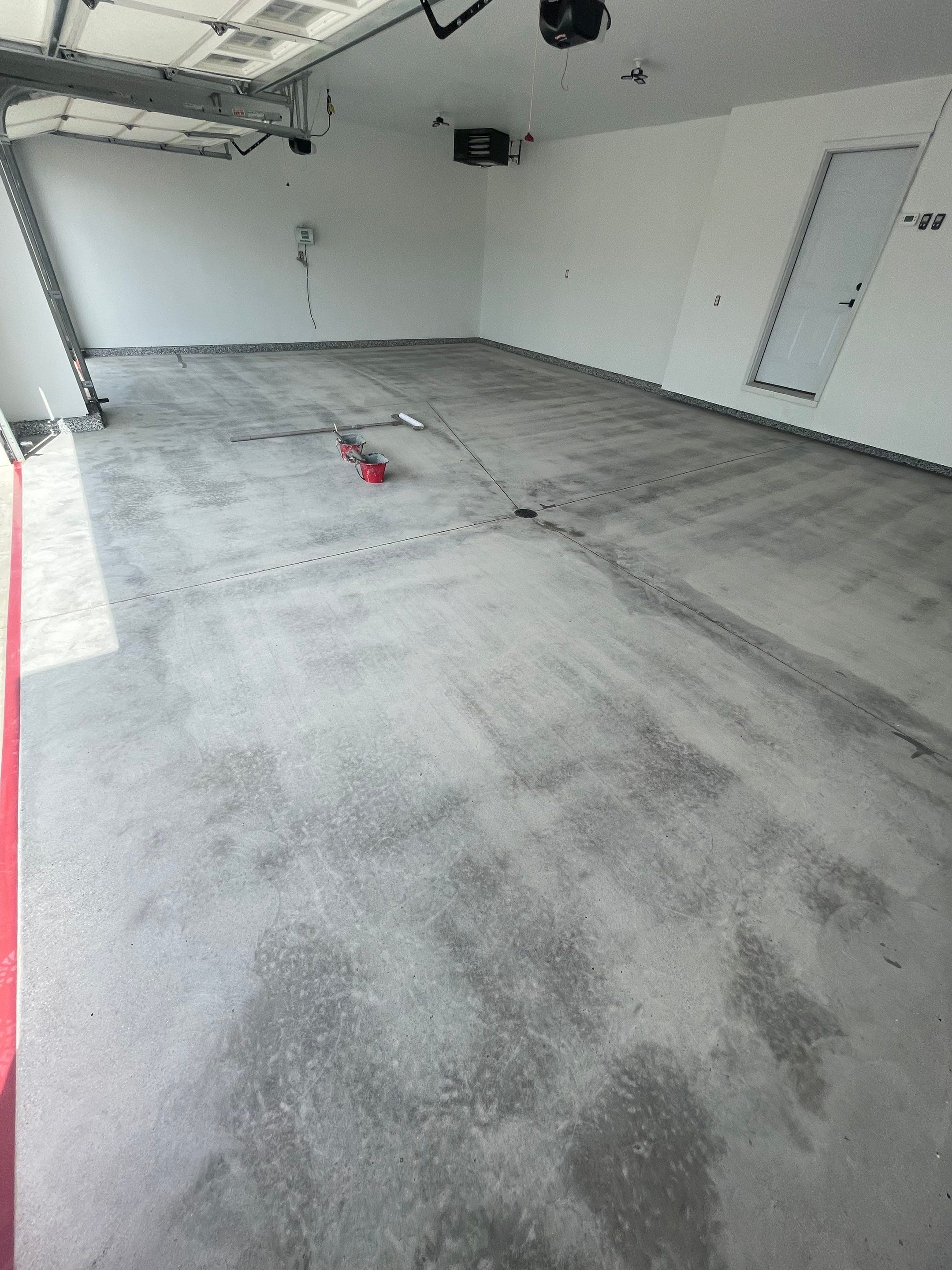 Grey Flake Epoxy Garage Floor Coating in Sioux Falls by Select Painting, Coatings & Garage Cabinets