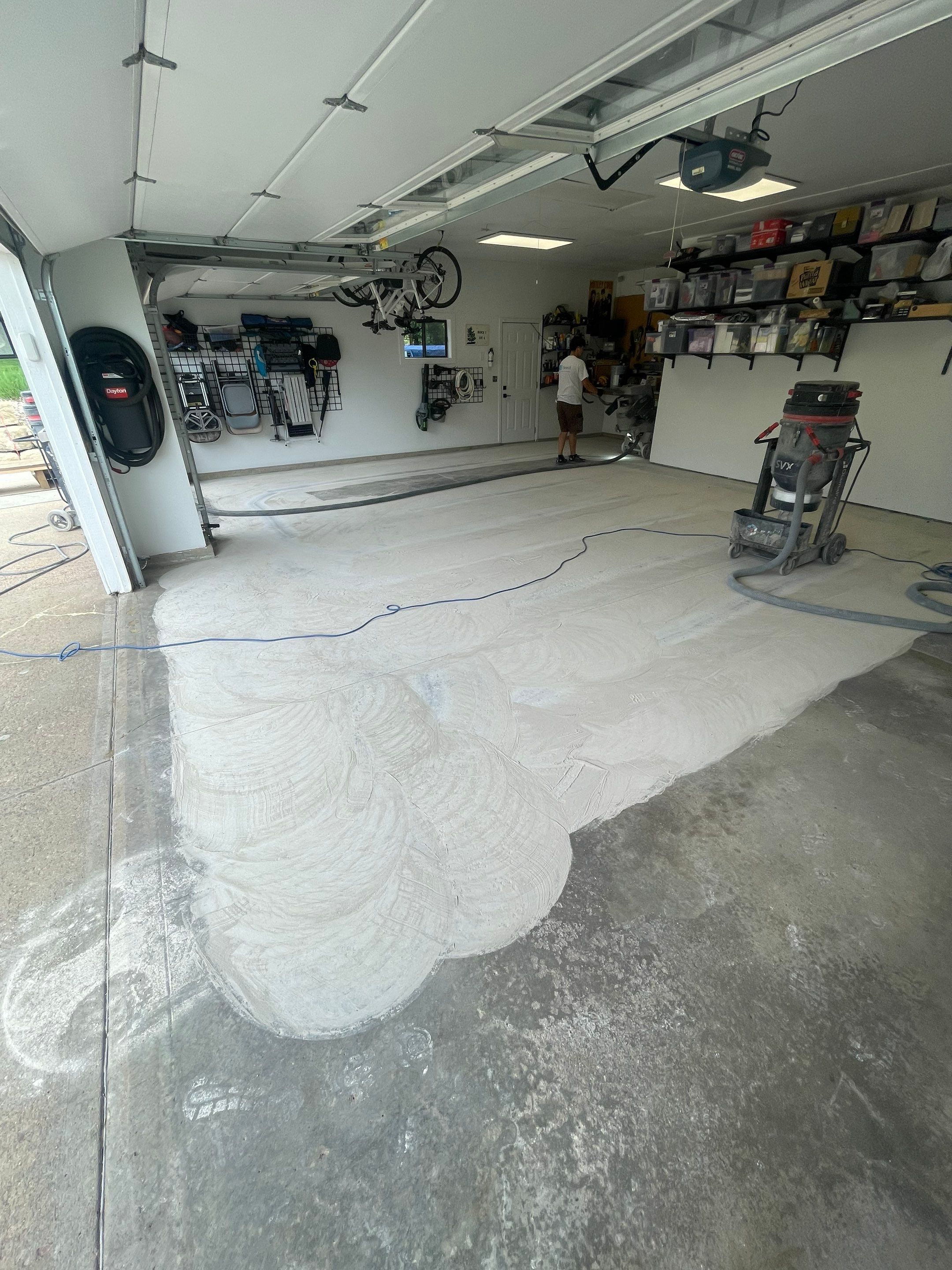 Feather Grey Garage Floor Coating Installation in Sioux Falls by Select Painting, Coatings & Garage Cabinets