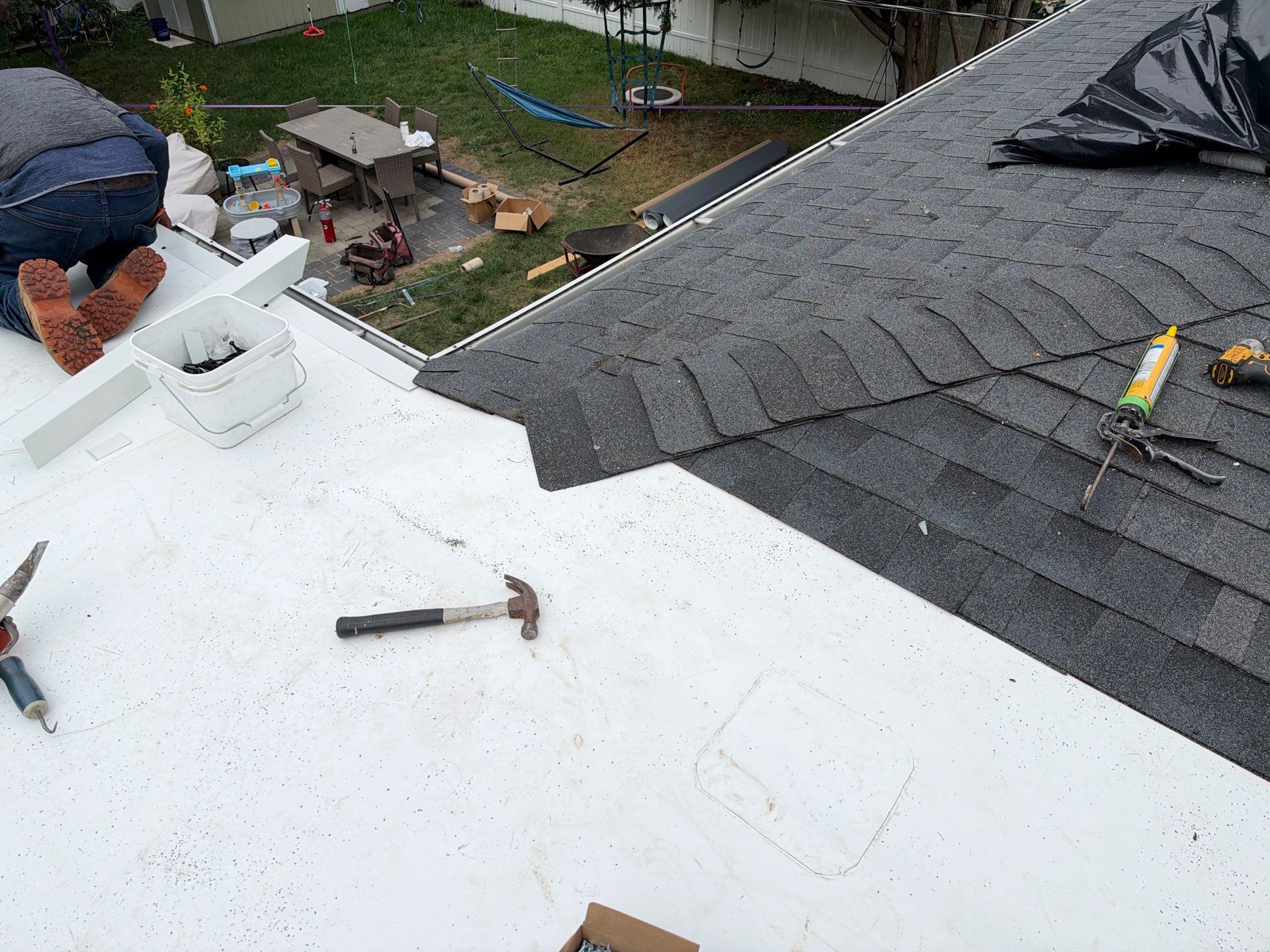 Richmond Roof Replacement Including Flat Membrane and Asphalt Shingles by Cade Construction