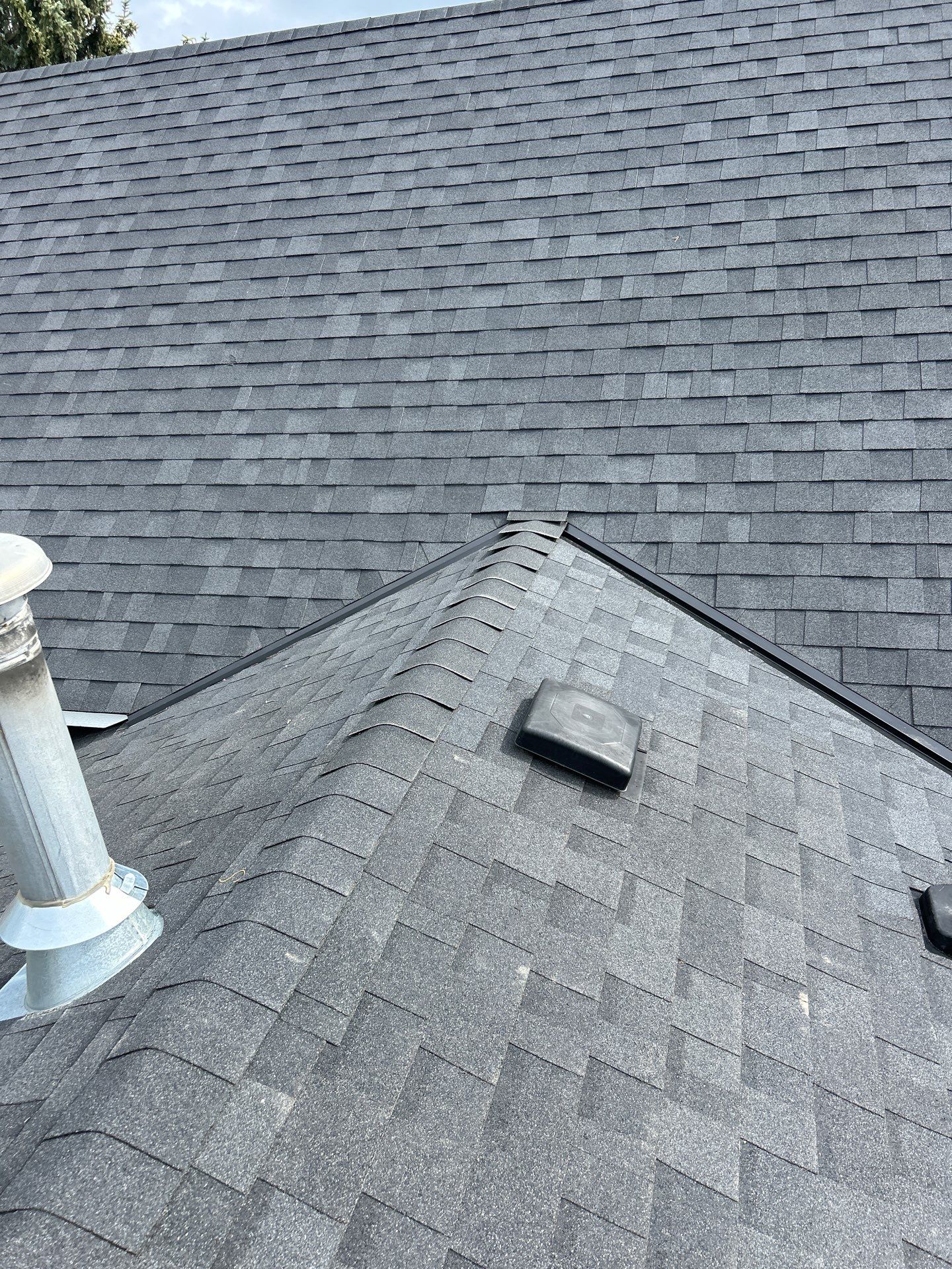 Residential Roofing Installation using OC onyxs black shingle by Top Notch Roofing Inc