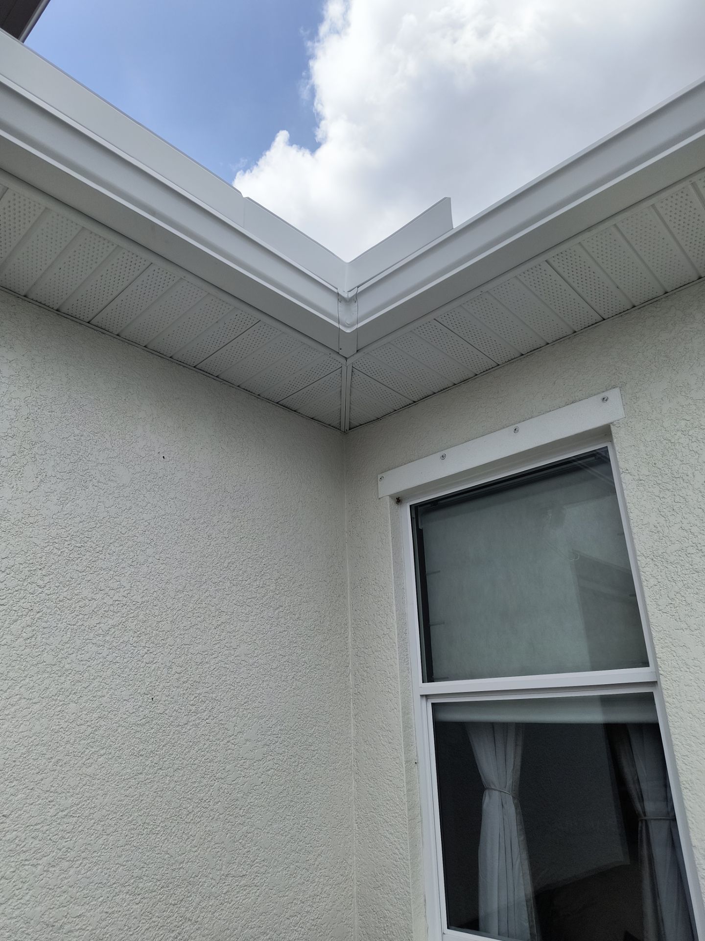 White Seamless Gutters with Downspouts in Bradenton FL by Gutter Professors