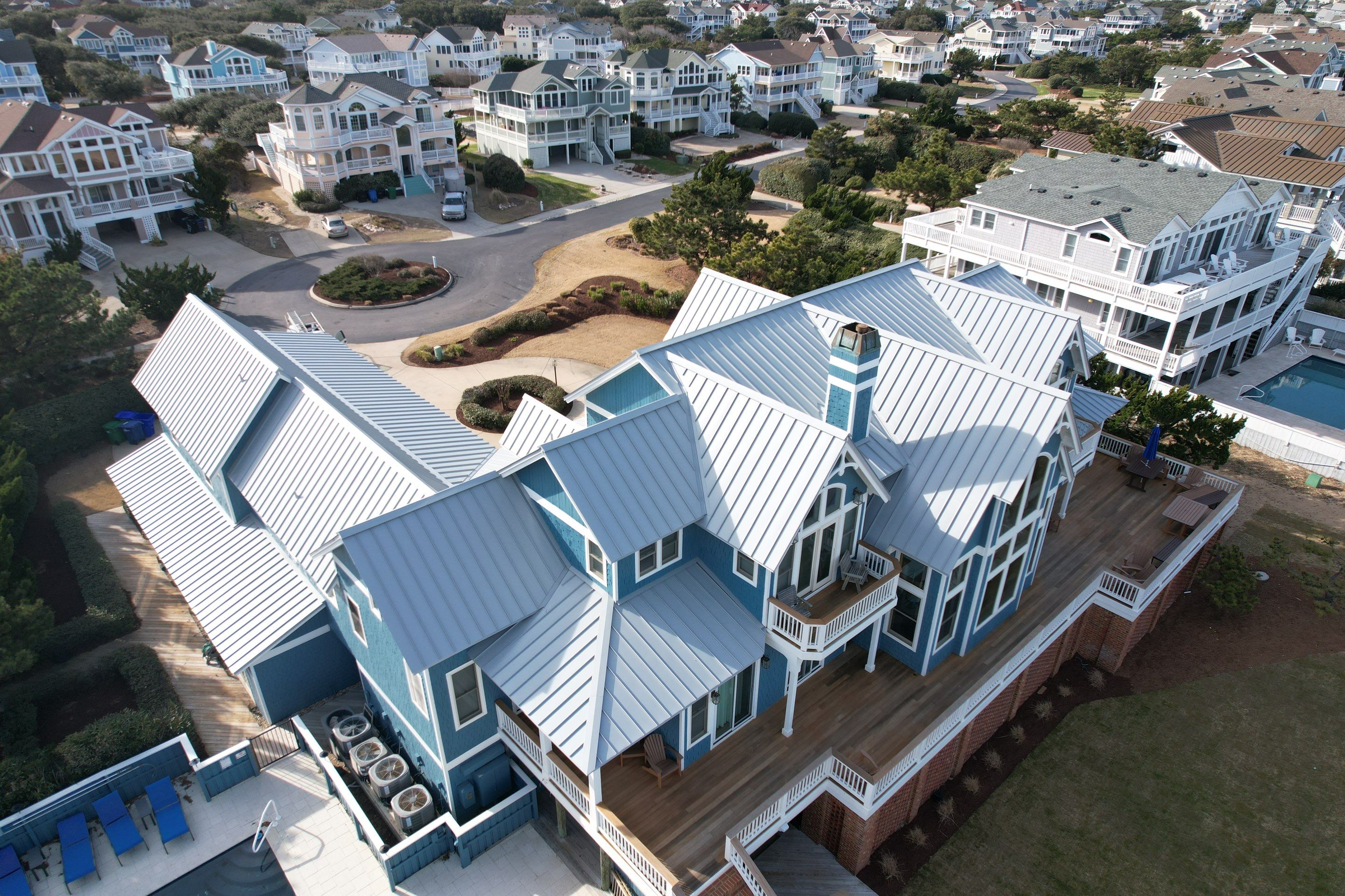 Large Metal Roof Transformation by Gallop Roofing & Remodeling, Inc.