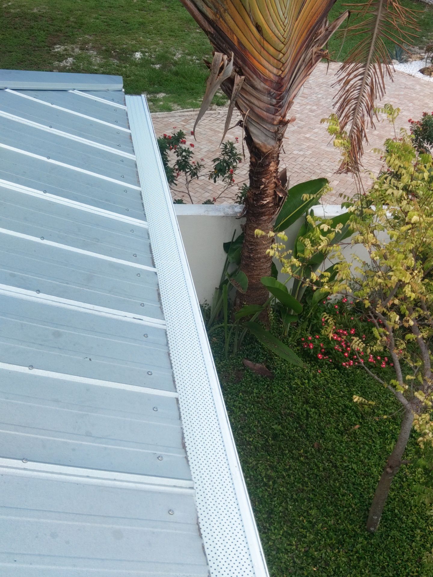 Gutter guards installation combined with gutter cleaning in Sarasota, FL by Gutter Professors