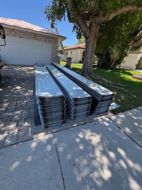 Residential Roofing Installation using 1" Nail strip metal roof by BLUES BROTHERS ROOFING
