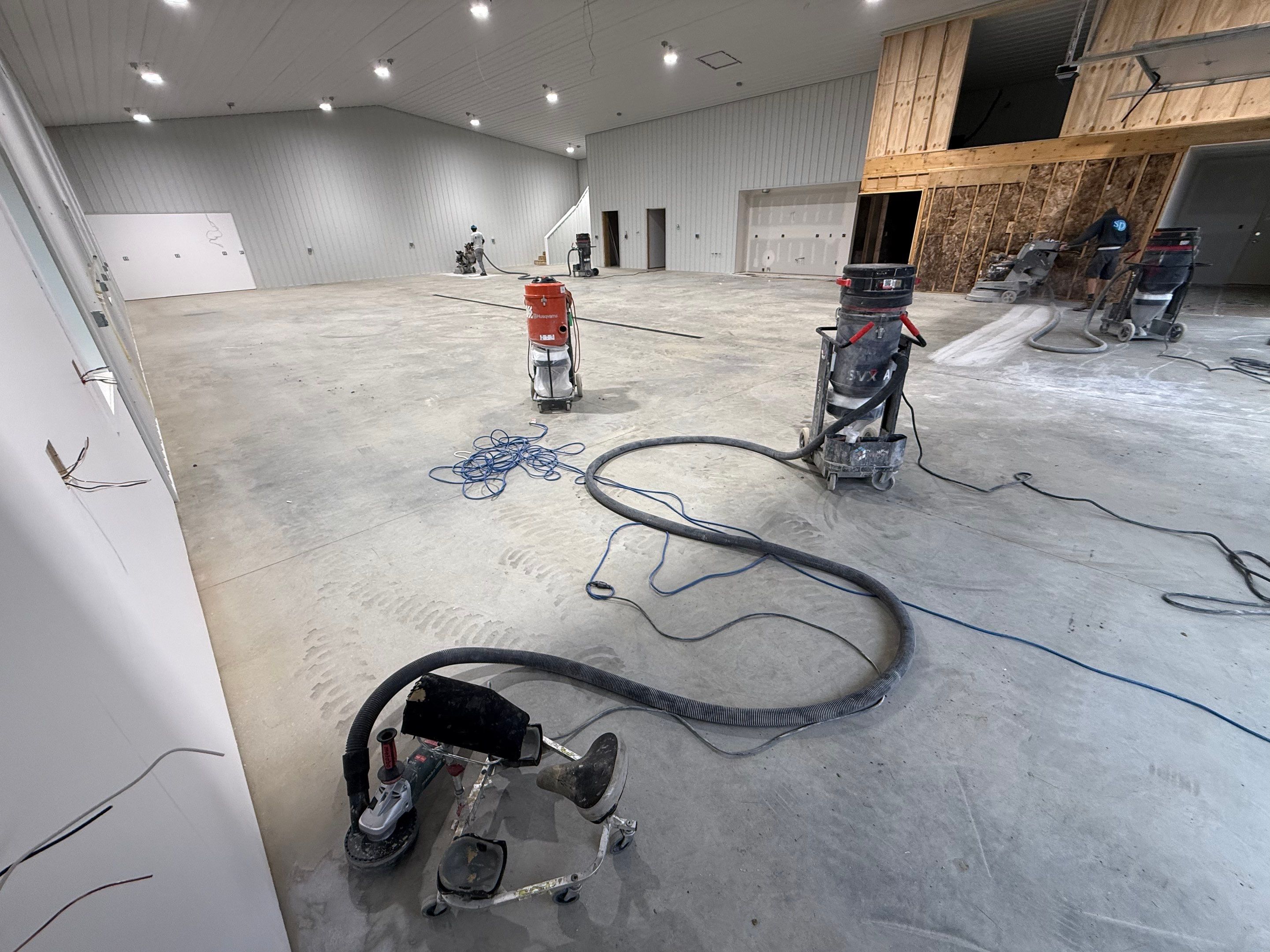 Custom Speckled Floor Coating for Large Montrose Shop by Select Painting, Coatings & Garage Cabinets
