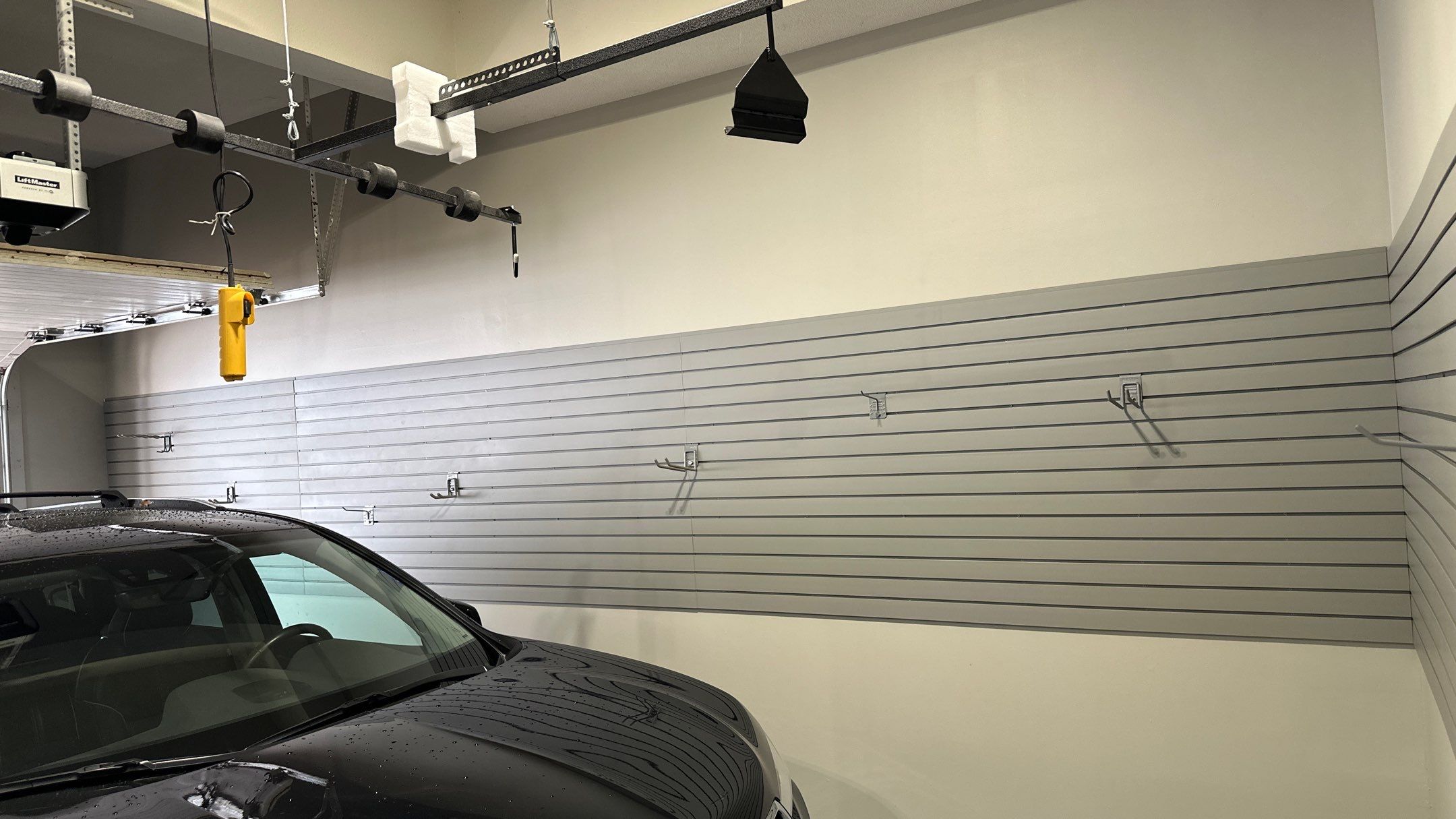 Matt F. added cabinets and slotwall to his garage by Banner Garage