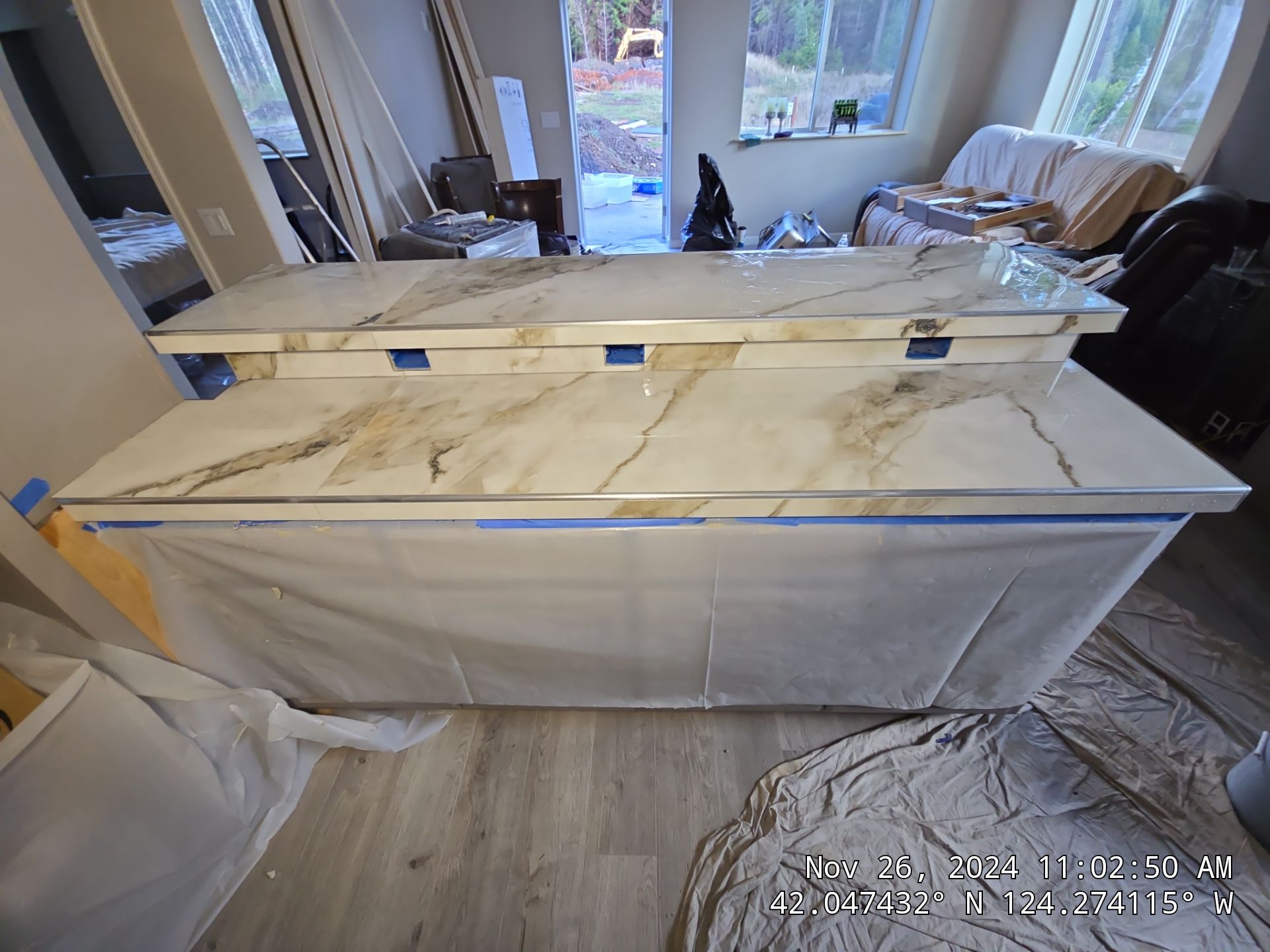 Marble Look Countertop and Stone Tile Backsplash Installation in Brookings by KMD Surfaces INC.