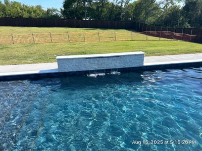 Modern Geometric Pool with Raised Wall Feature