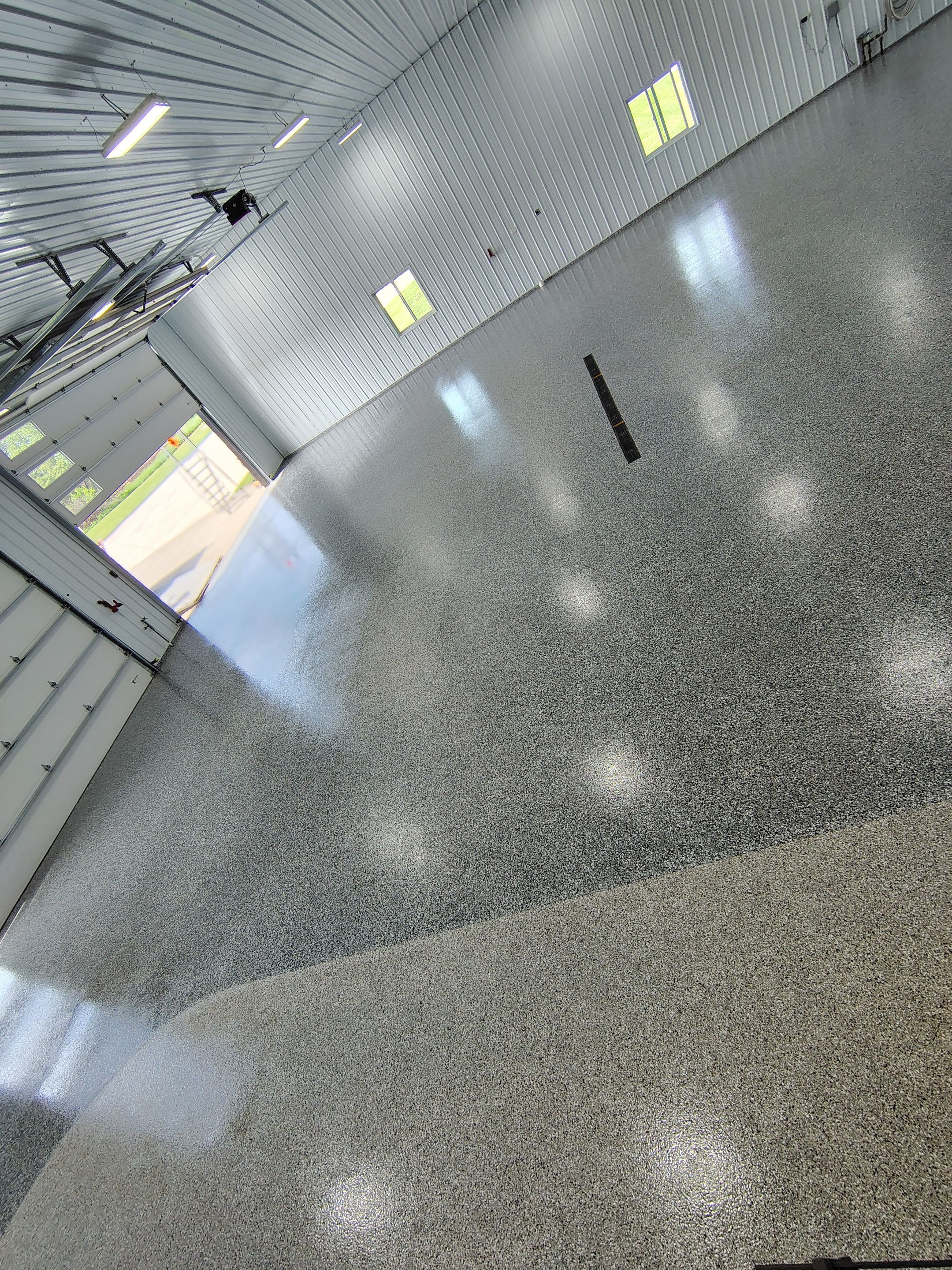 Multi-Stage Concrete Floor Coating for Egan Shop and RV Storage by Select Painting, Coatings & Garage Cabinets