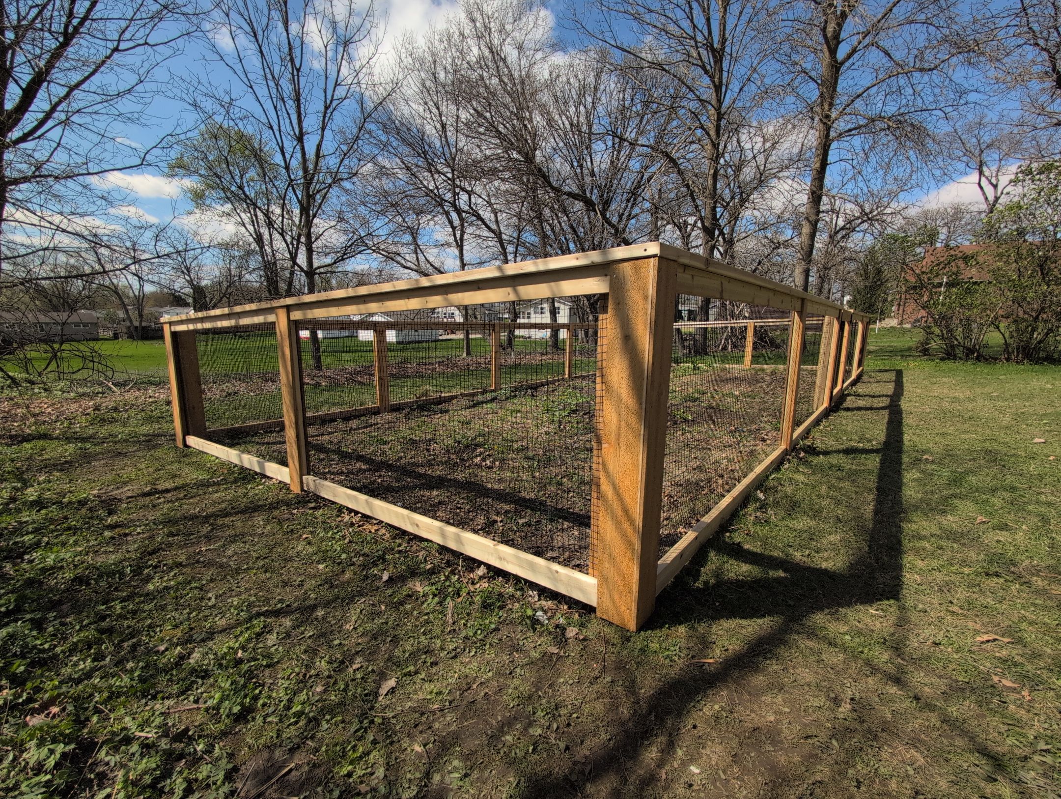 Custom Cedar Wood Garden Fence Installation in Cedar Falls by Perfect Picket Fence and Stain