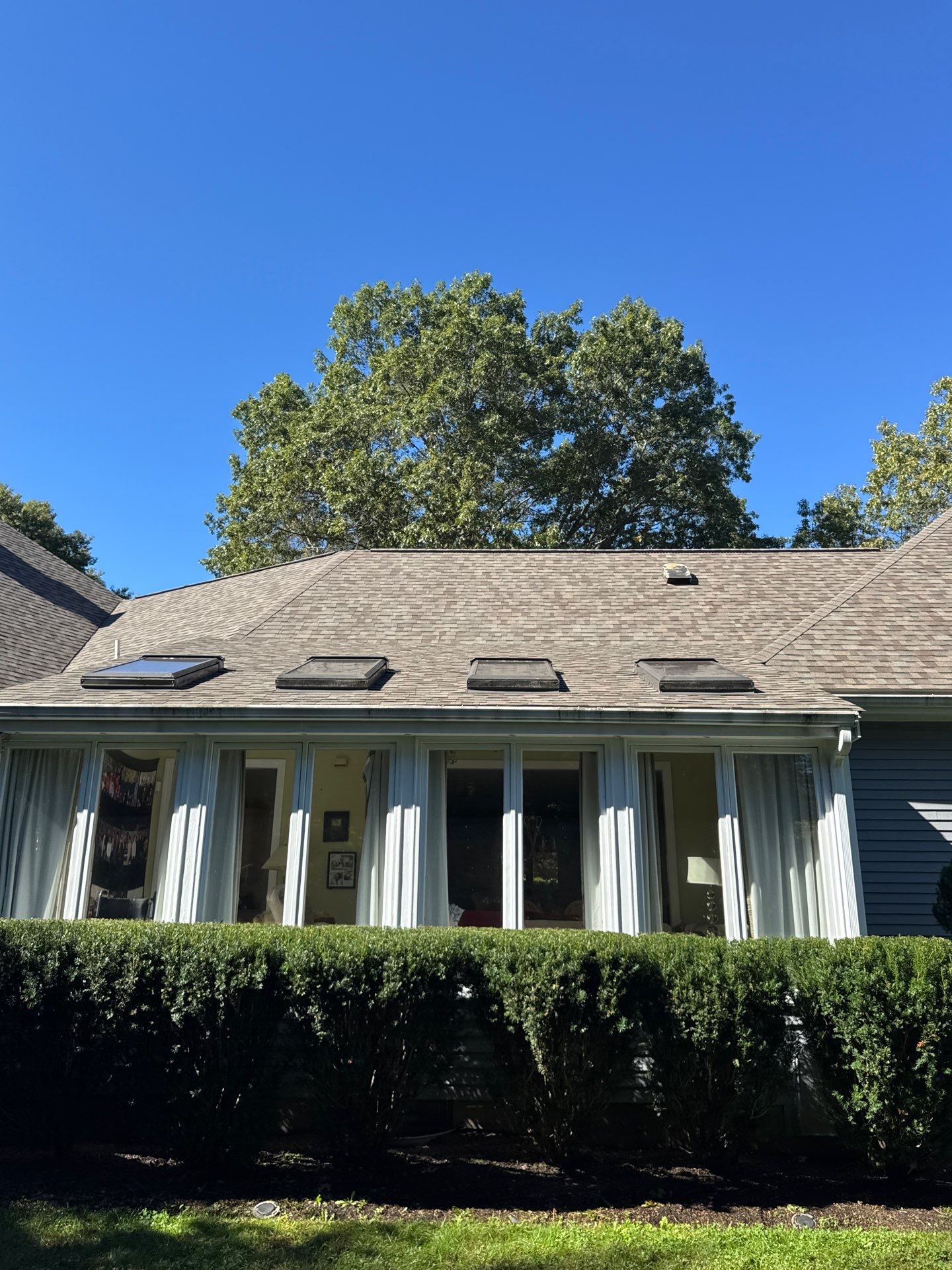 Full Asphalt Shingle Roof Replacement with Skylight Flashing – Concord, MA by Mighty Dog Roofing of Greater Middlesex County
