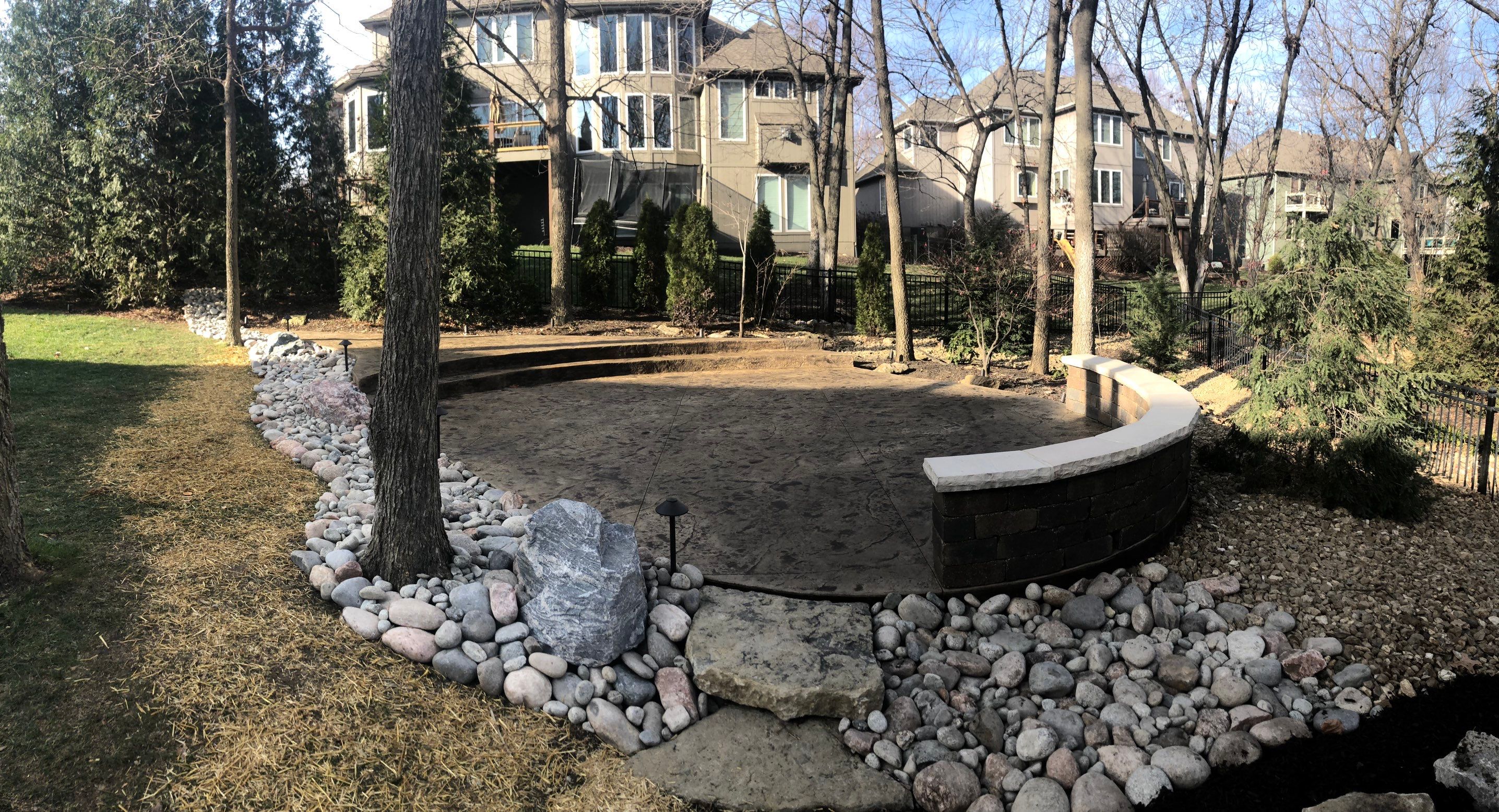 Back Yard Alpine Stamped Patio by LAND ESCAPES LLC