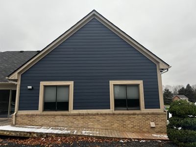 Siding Replacement using James HardiePlank Cedarmill in Deep Ocean color