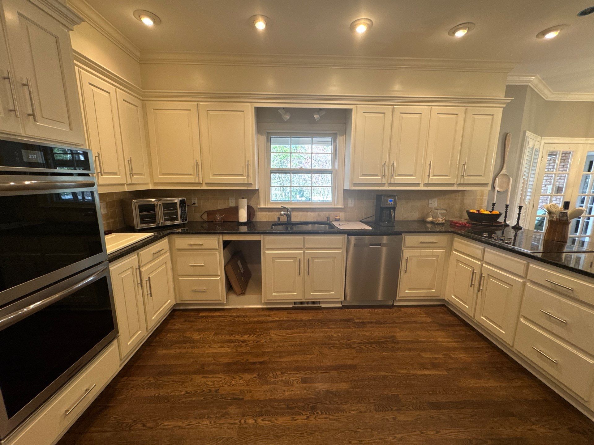 Dark Walnut Hardwood Floor Refinishing and Cabinet Painting in Atlanta by Swift Home Renovations