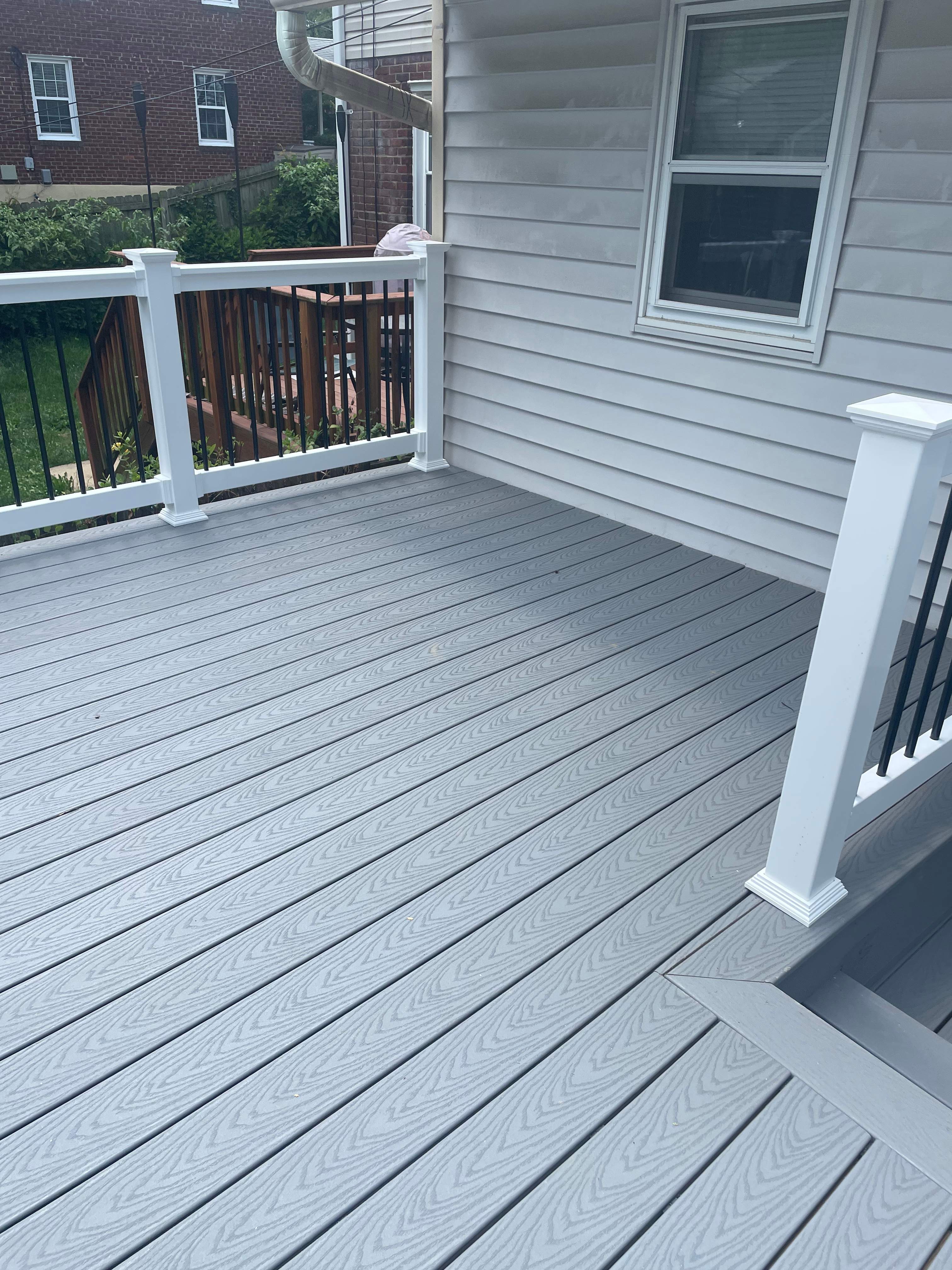 Deck resurfacing, railing replacement and concrete resurfacing by Fairfax Contractors, LLC