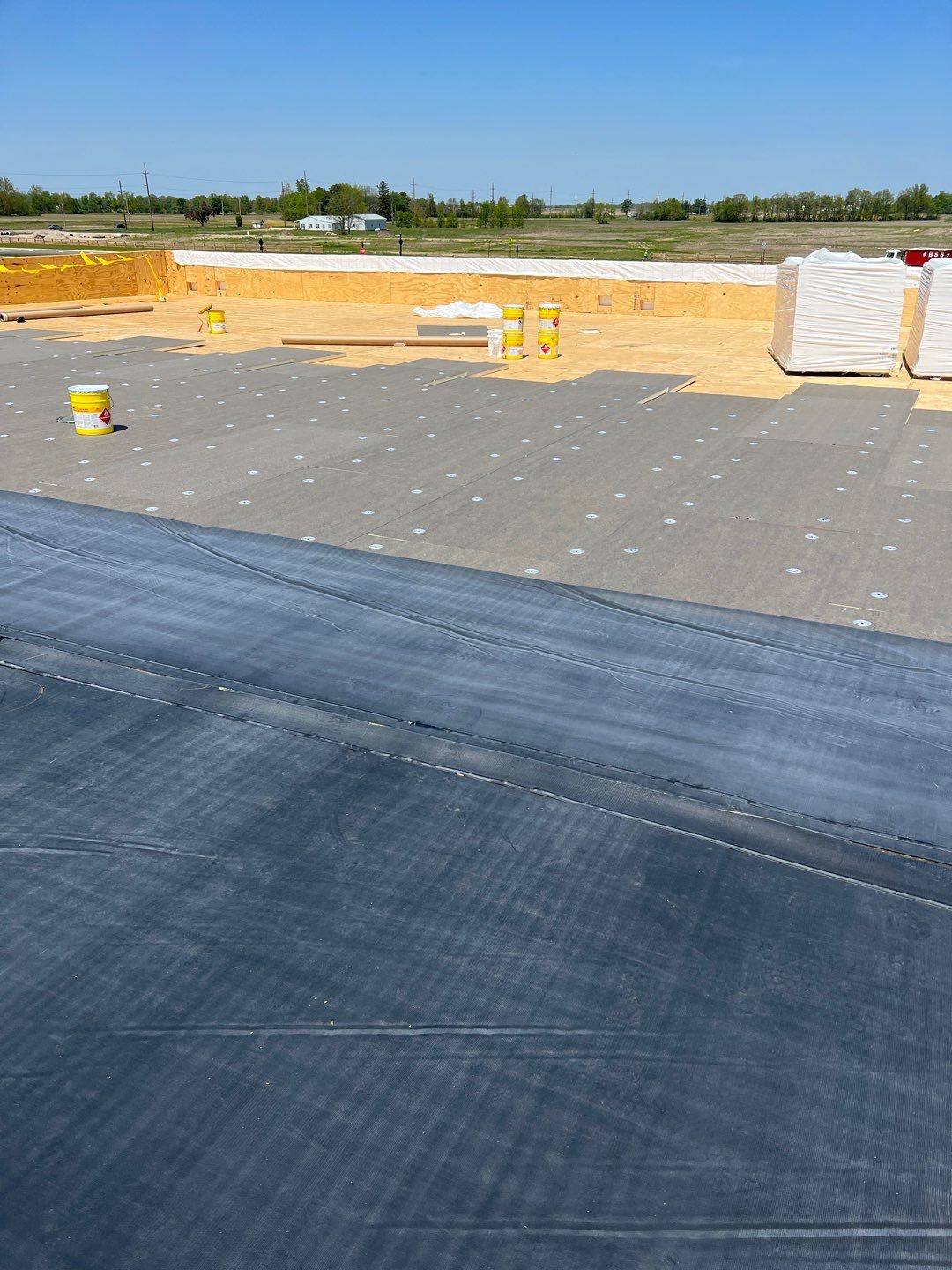 Commercial Roofing Installation using 60 mil rubber roof  by Nitro Roofing and Construction