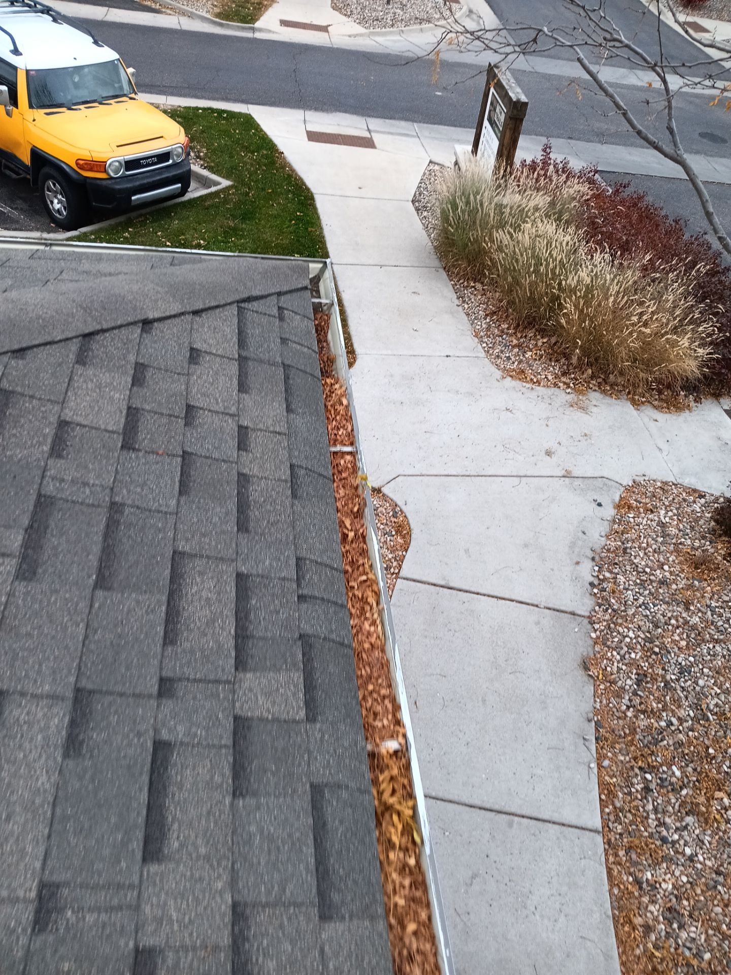 Commercial gutter cleaning Cheyenne, WY before photo with filled gutters
