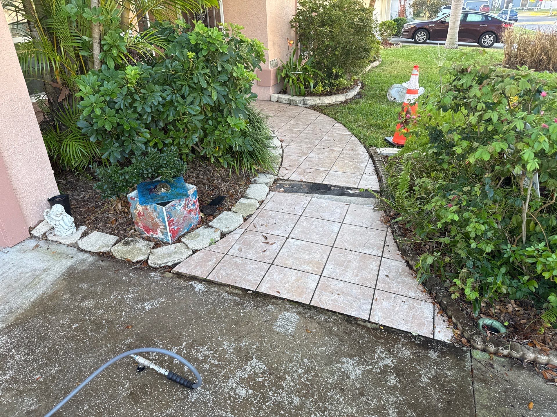 Concrete Driveway, Entryway, Flowerbed Curbing & Statue Cleaning in Heather Glen, Palmetto, FL | Sunshine AquaWash by Sunshine AquaWash