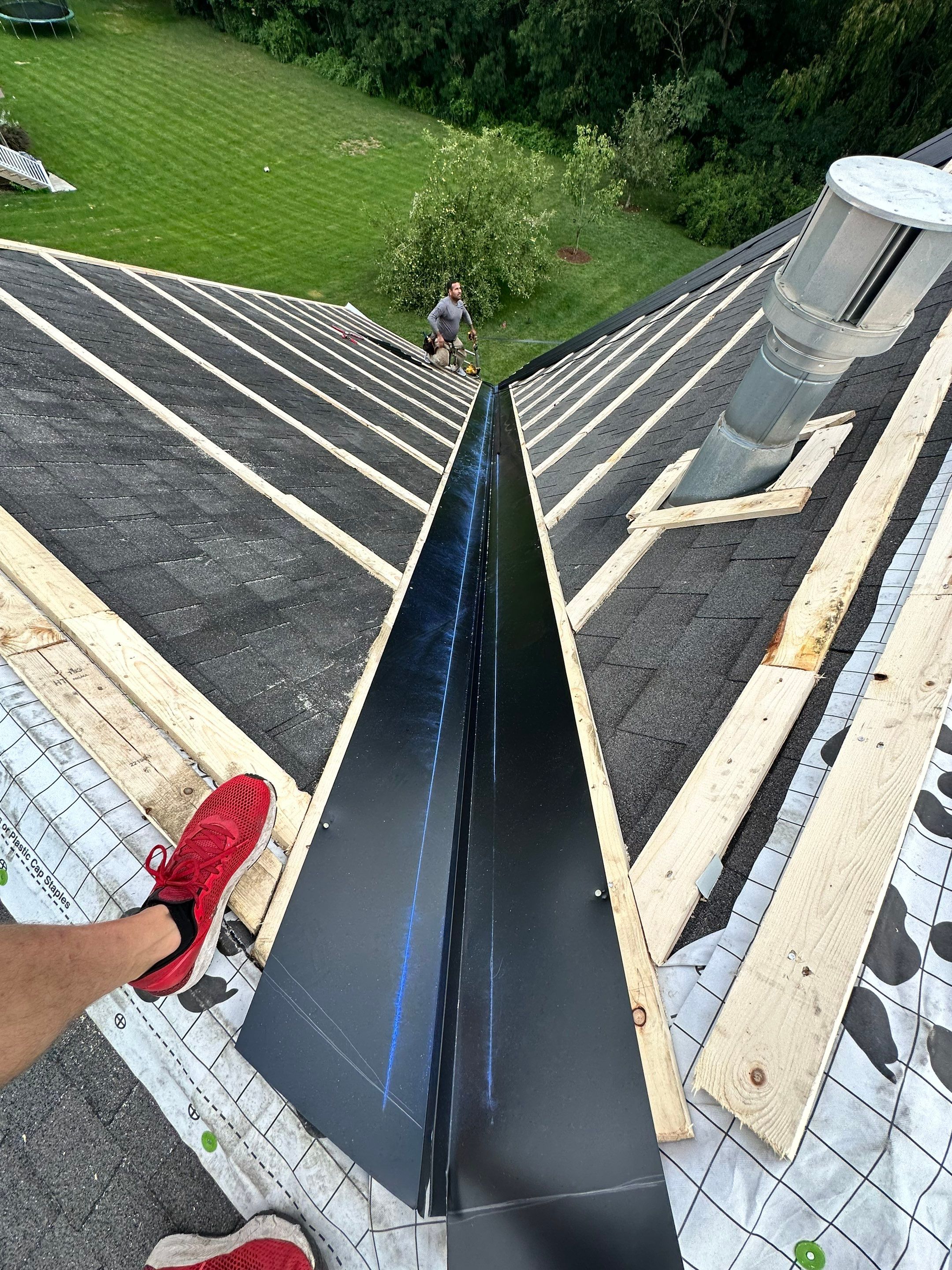 Standing seam / Azm panel in black  by Teflon Roofing