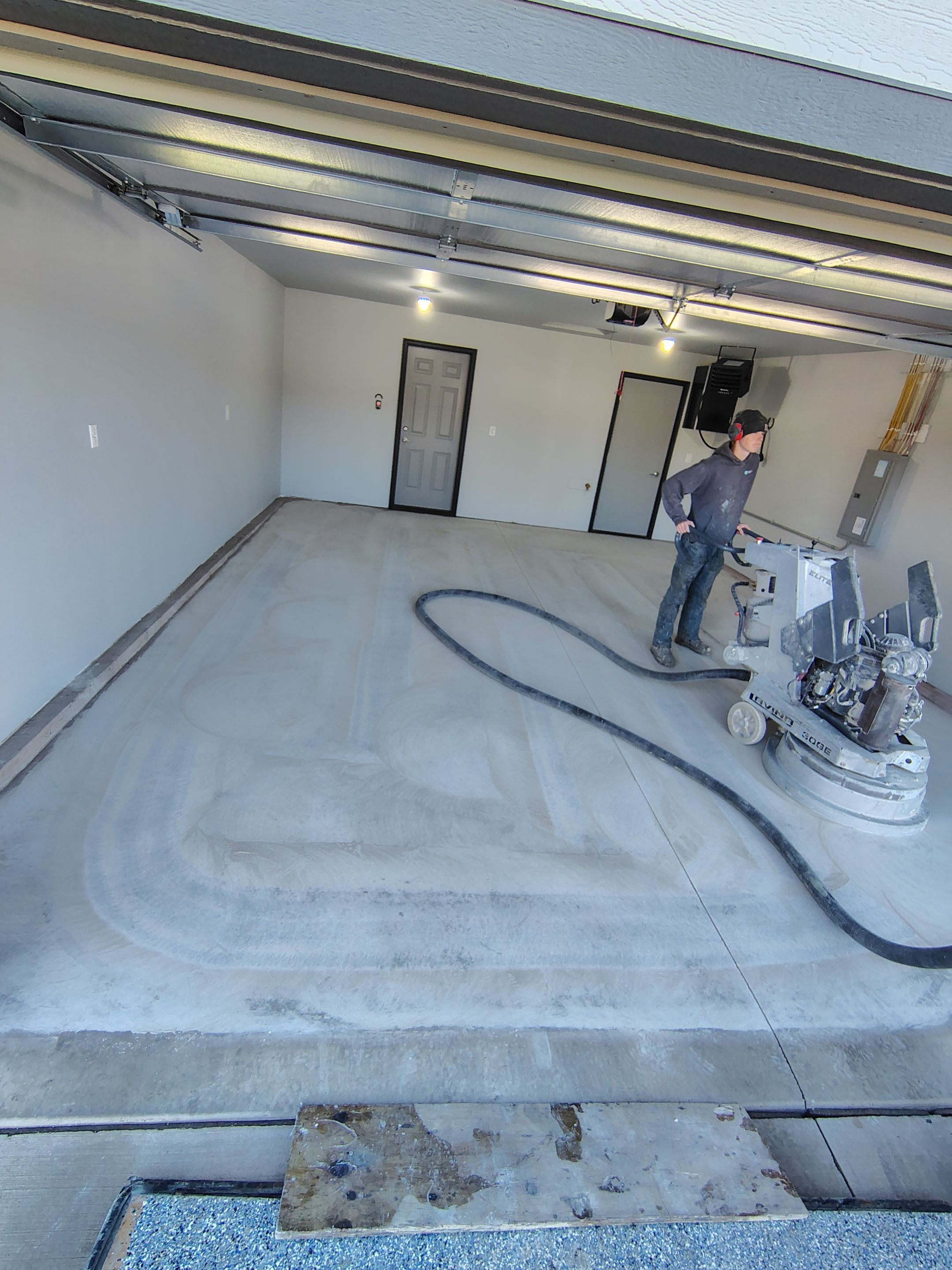Custom Epoxy Garage Floor Coating Installation in Sioux Falls by Select Painting, Coatings & Garage Cabinets