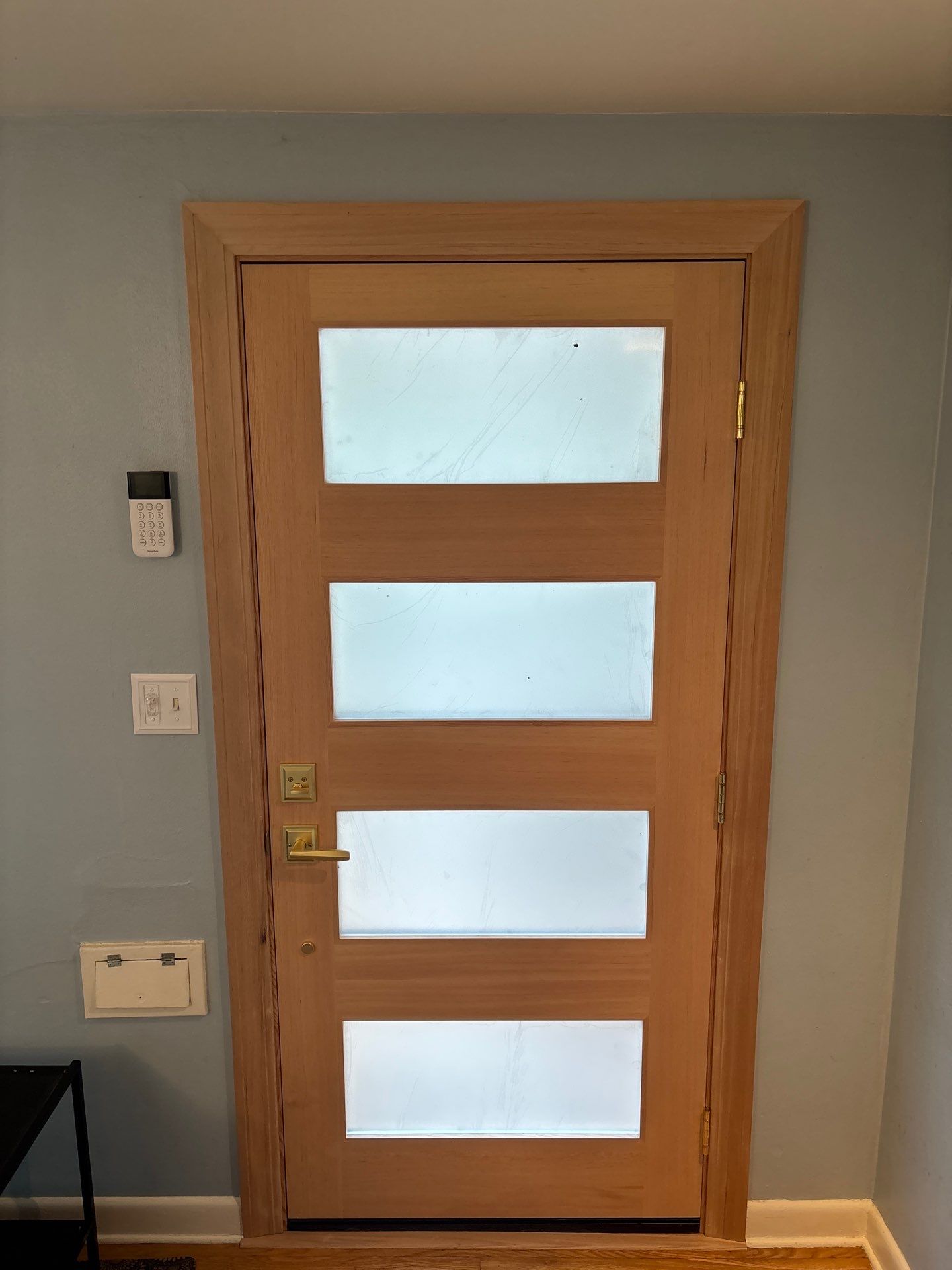 Modern Wood Entry Door Replacement with Frosted Glass in Seattle by Emerald City Energy