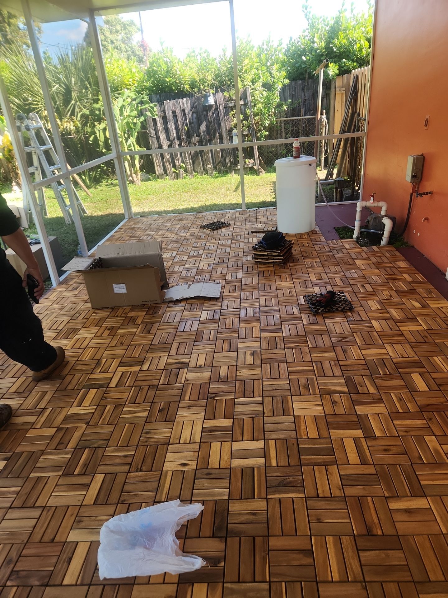 Insulated Screen Enclosure and Wood Tile Deck Installation in Plantation by Aastro Roofing