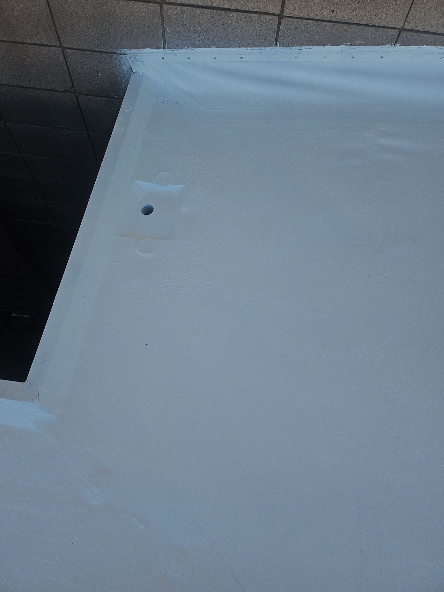 Single-ply restoration system using Benchmark/PUMA XL coatings over TPO single-ply roofing by Straight Edge Roofing Inc