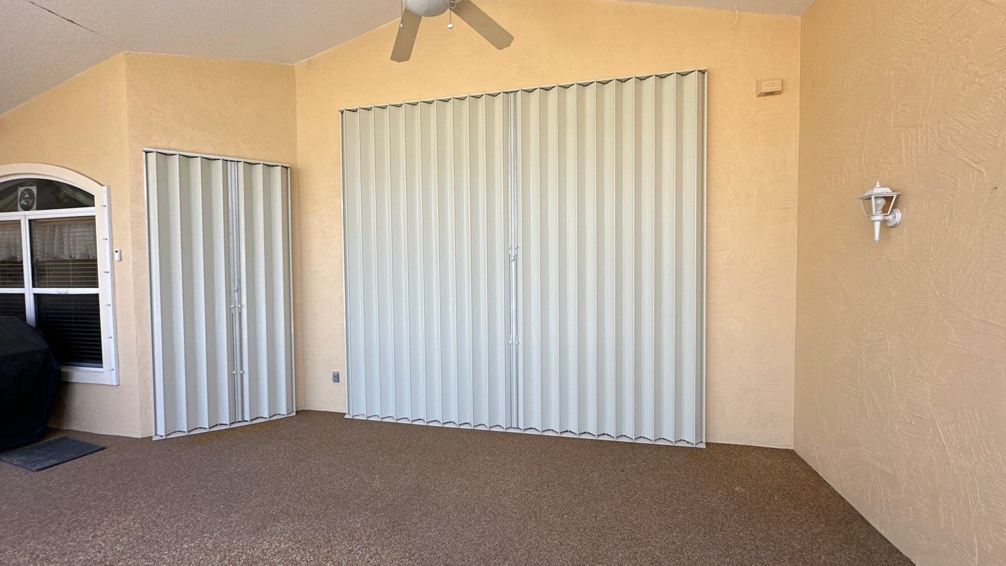 Accordion Shutters in White  by Smart Guard Shutters