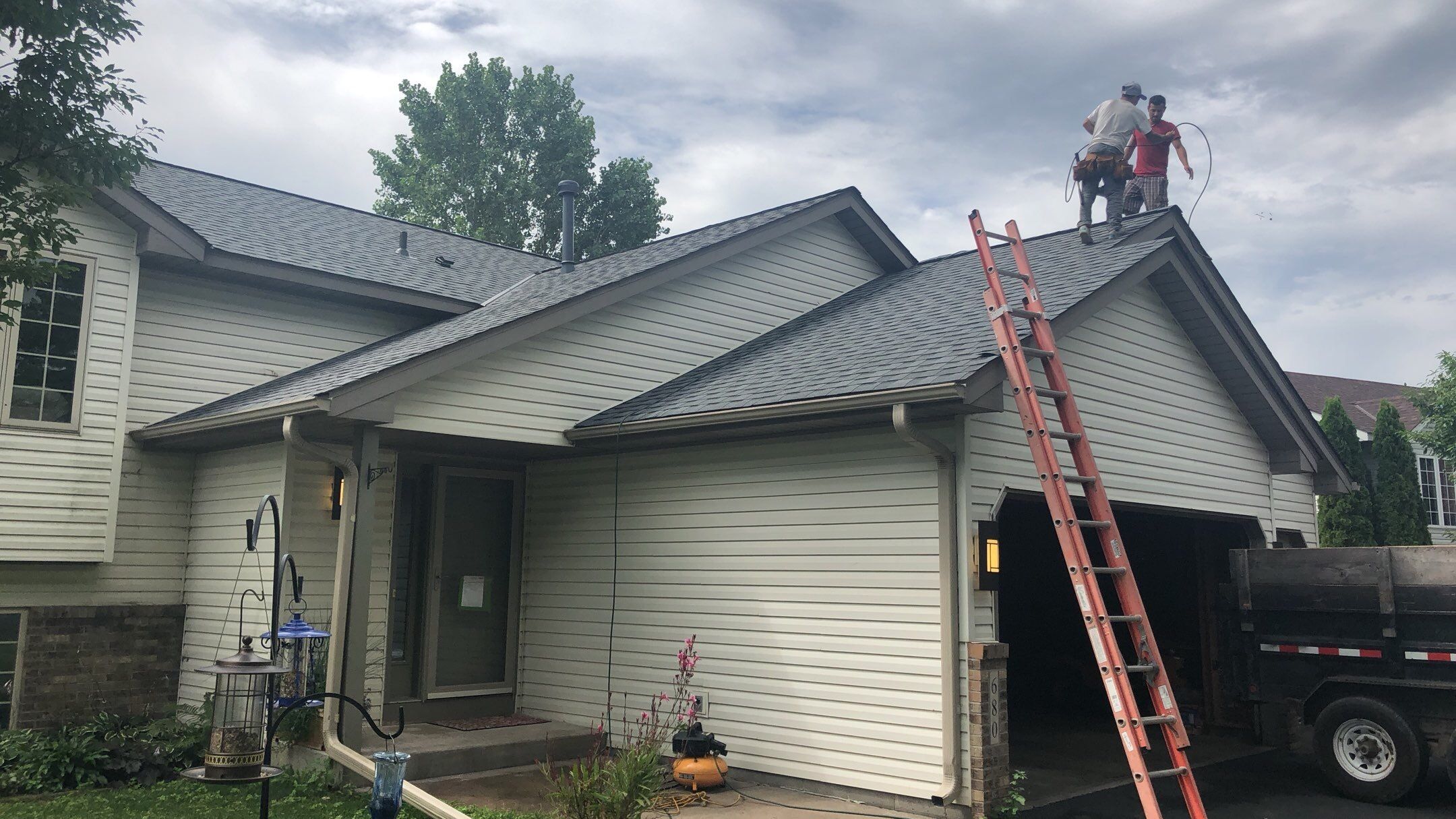 Storm Damage Restoration using Atlas Pinnacle Shingles and Mastic Vinyl Siding  by MODERN EXTERIOR SYSTEMS