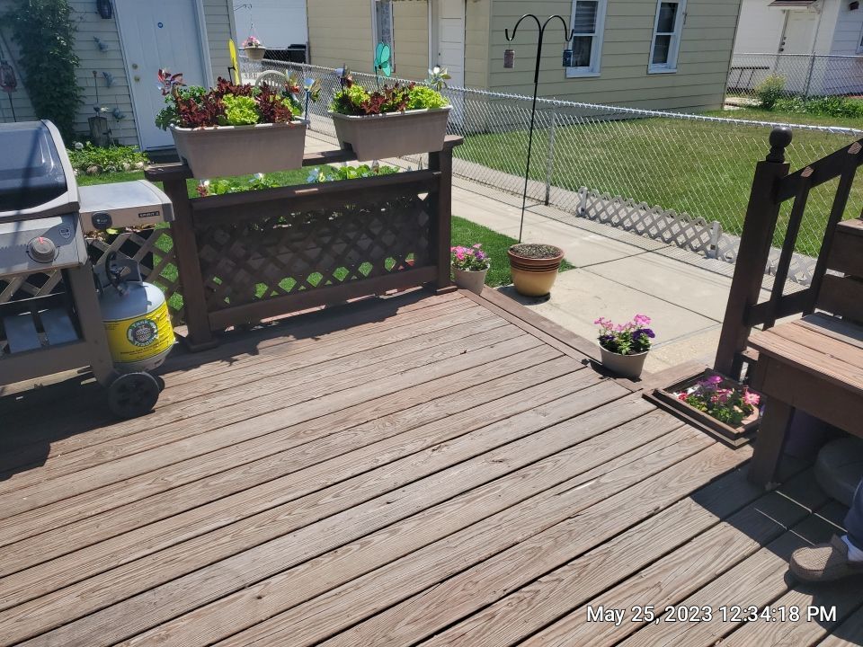 Wood cleaning and staining using Armstrong cloark oil stain by Northern Power Washing LLC.