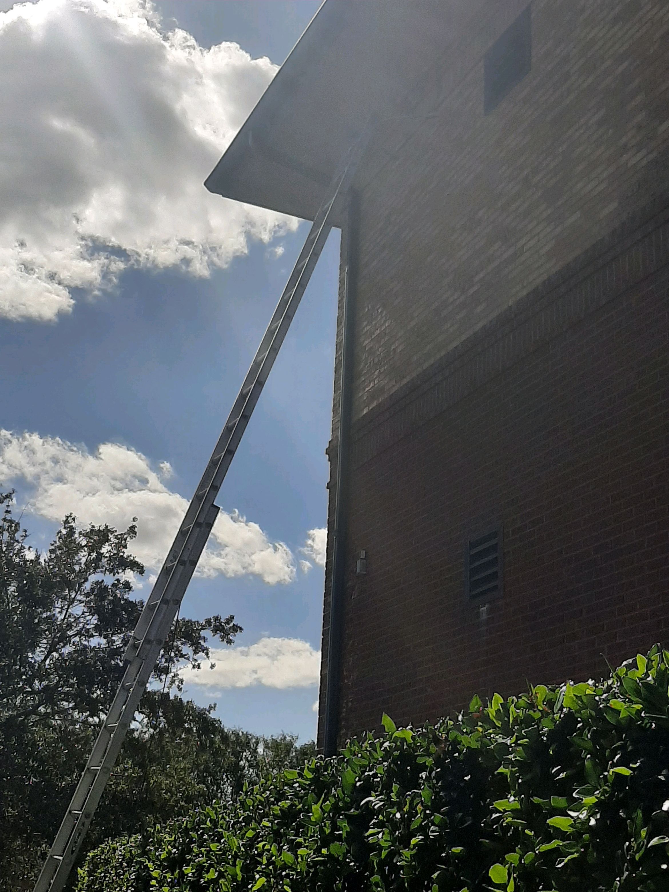 Pensacola Realtor Association Gutter Installation using K-Style White Gutters by Gutter Professors